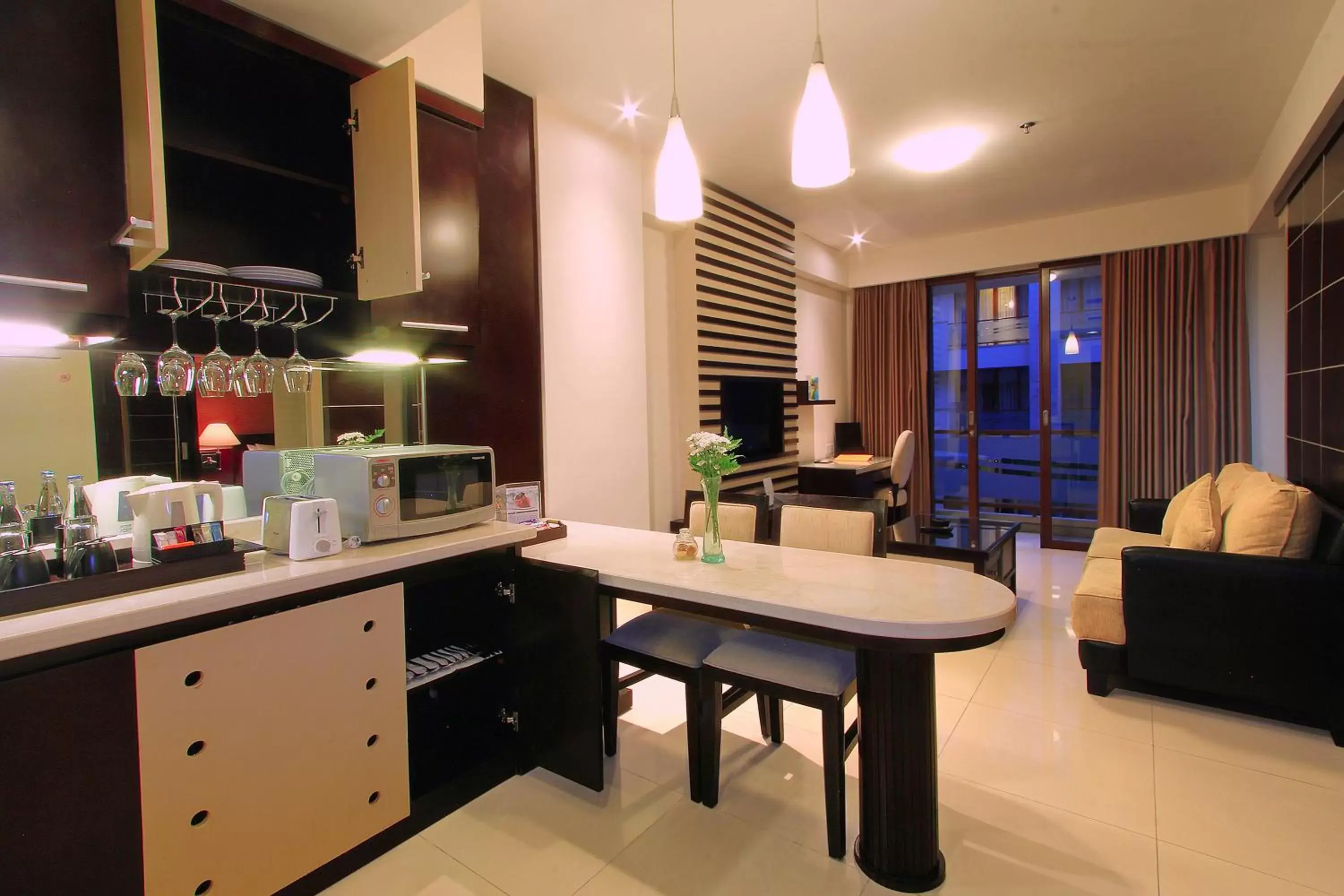 Kitchen or kitchenette, Seating Area in ASTON Kuta Hotel and Residence