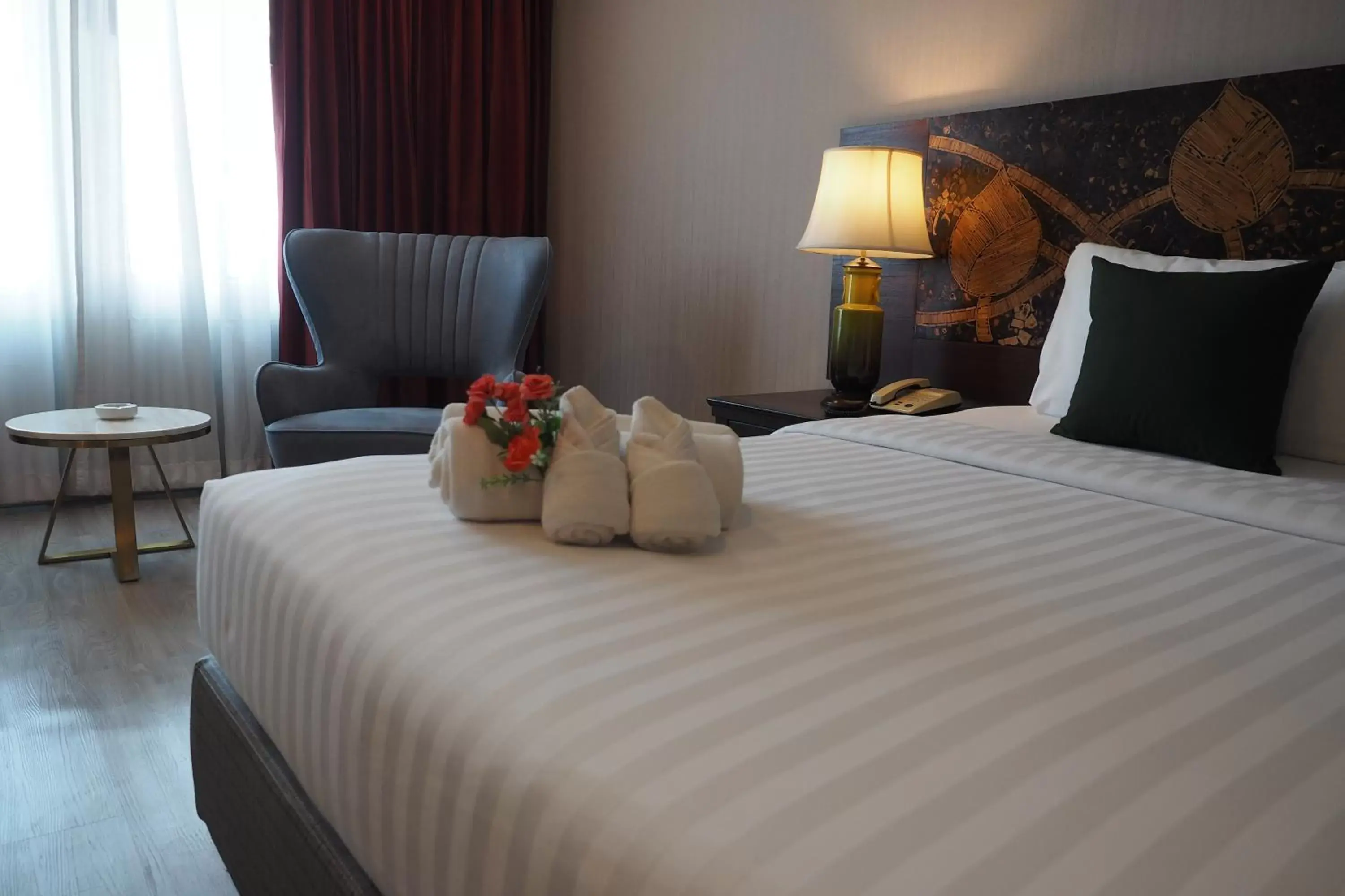 Bed in Empress Pattaya Hotel