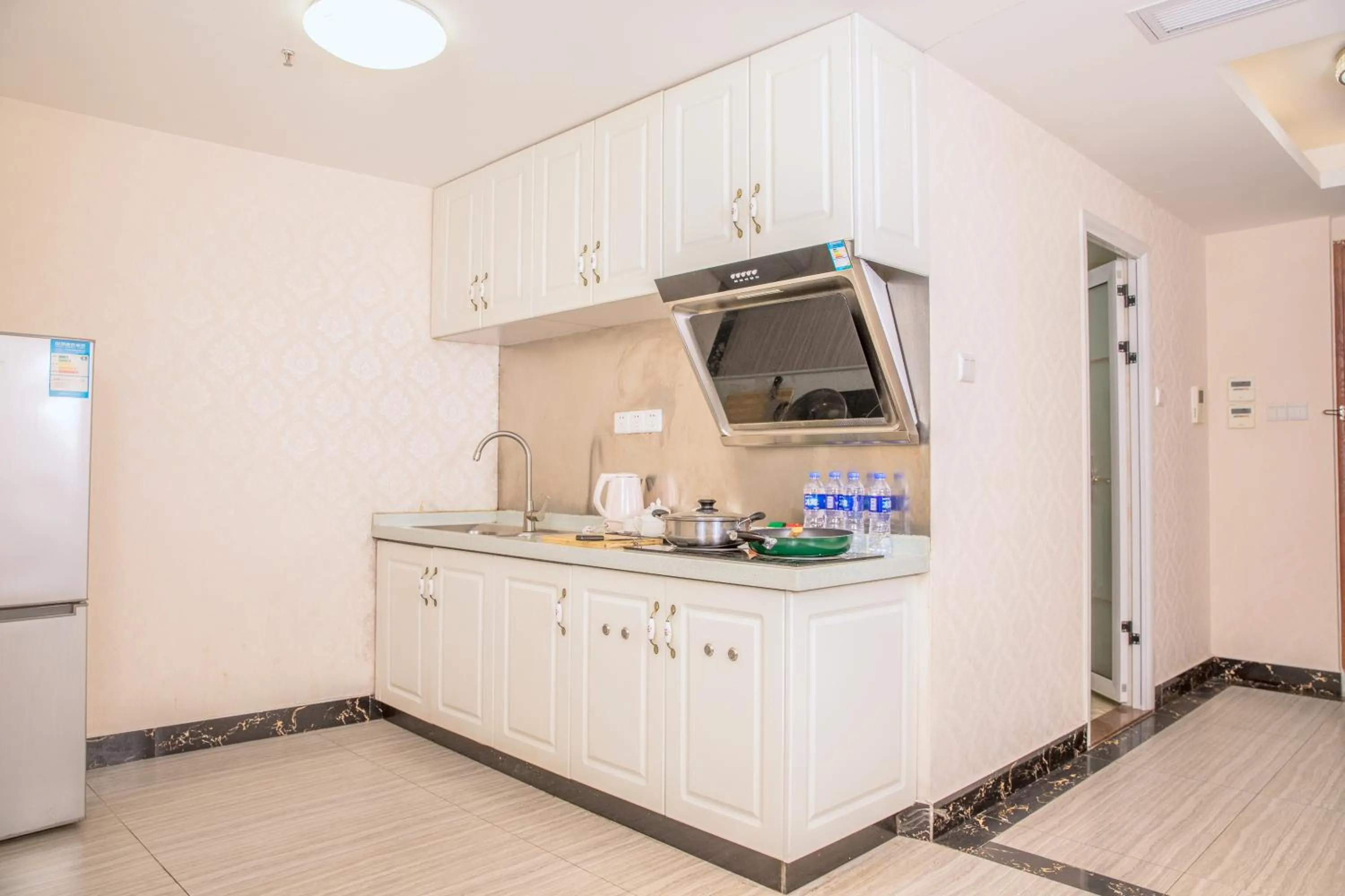 Kitchen or kitchenette in Guangzhou Pengman Apartment Zhengjia Huanshi Branch