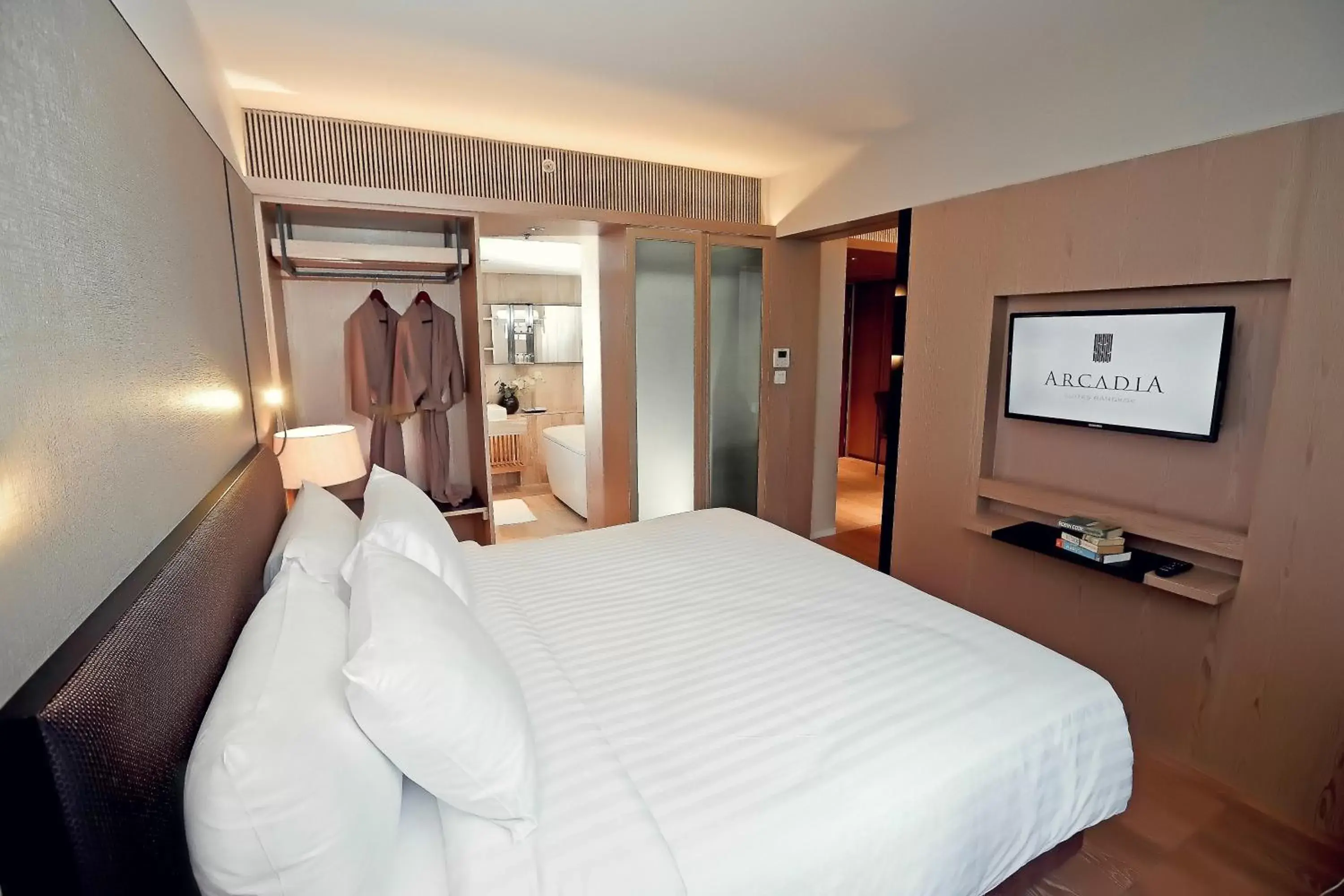 Bed in Arcadia Suites Bangkok