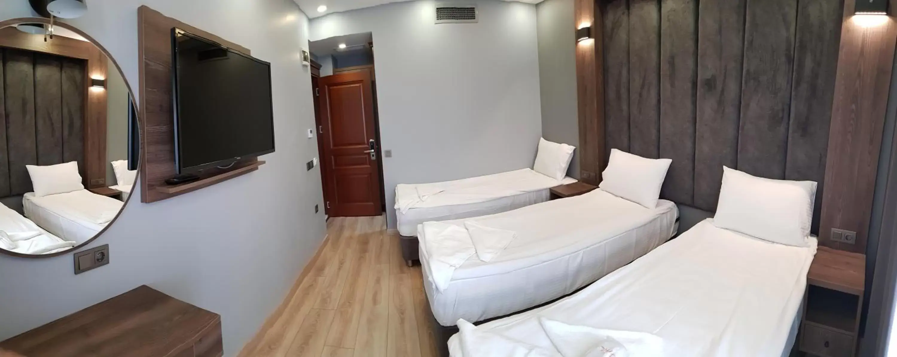 Communal lounge/ TV room, Bed in Basilissis Hotel