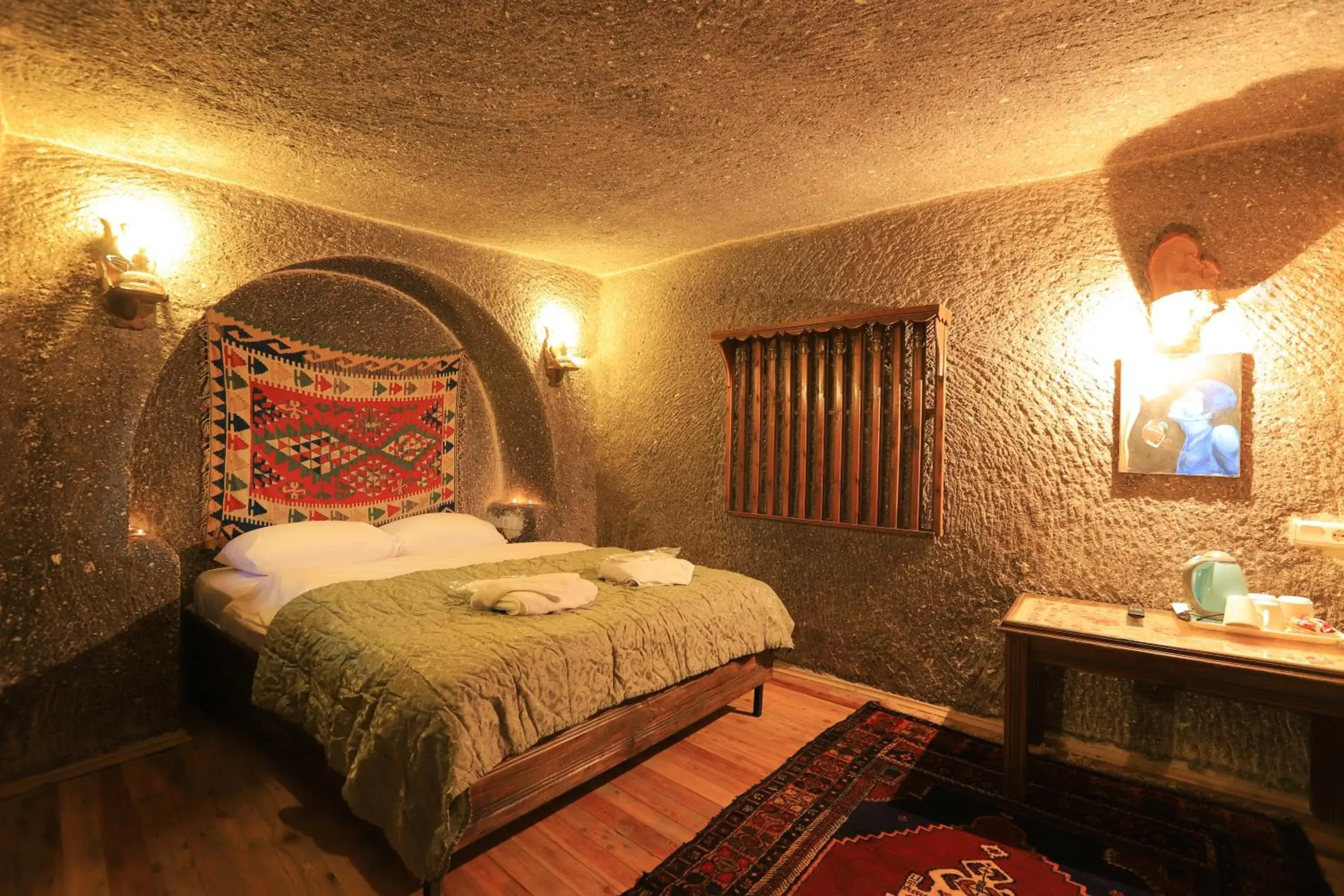 Property building, Bed in Antique Terrace Cave Suites Property building, Bed in Antique Terrace Cave Suites