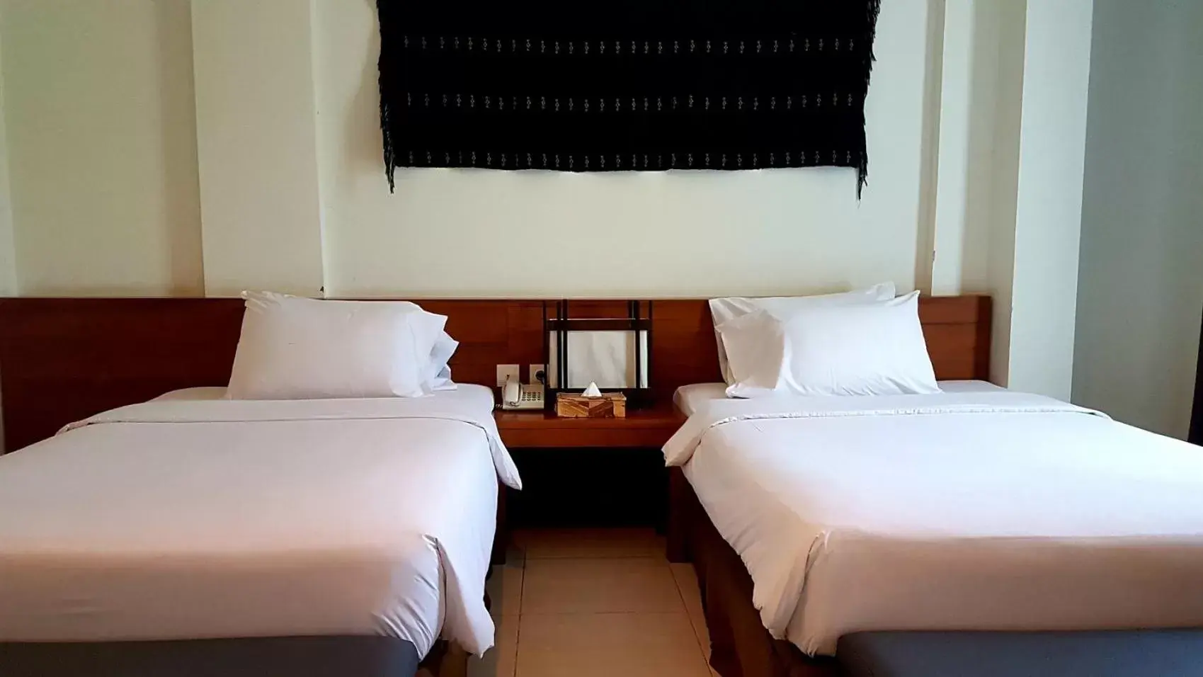 Bed in Luwansa Beach Hotel