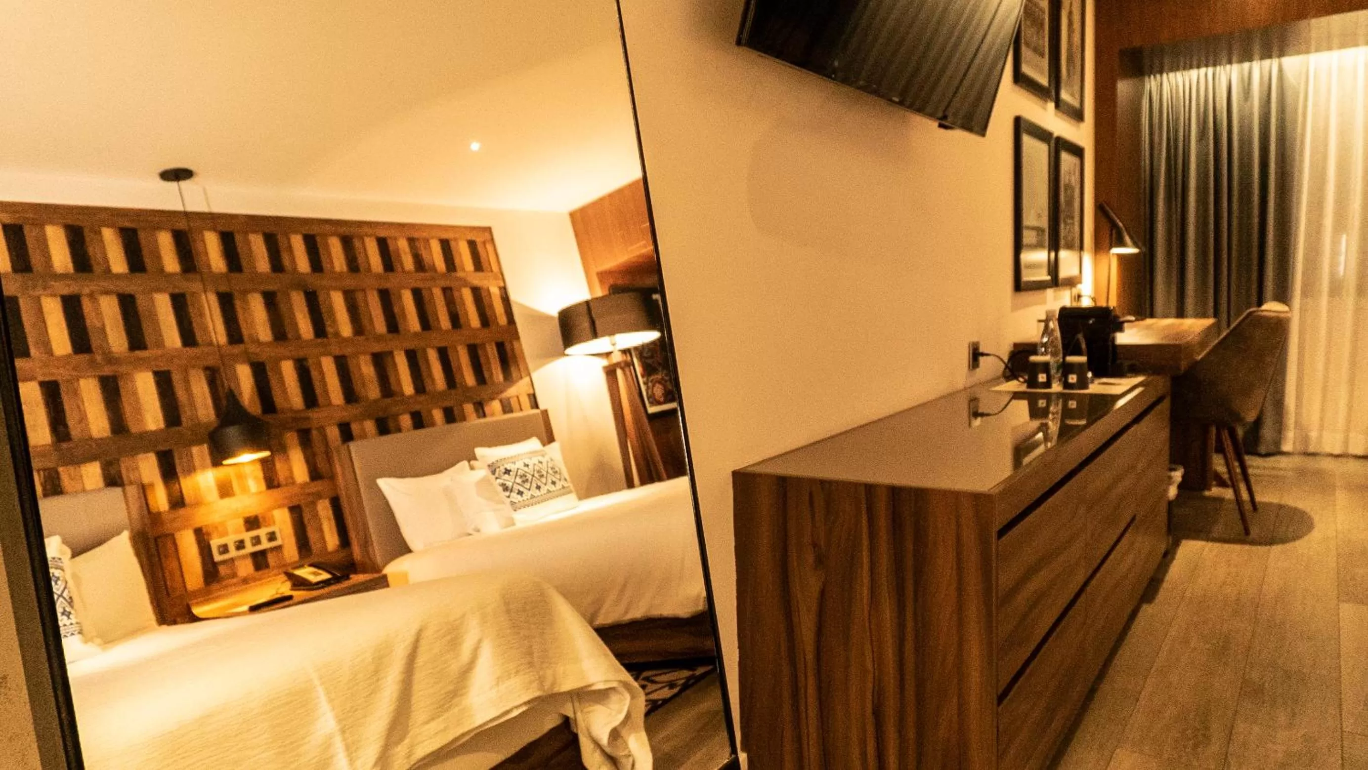 Bed in Hotel Indigo Guadalajara Expo by IHG