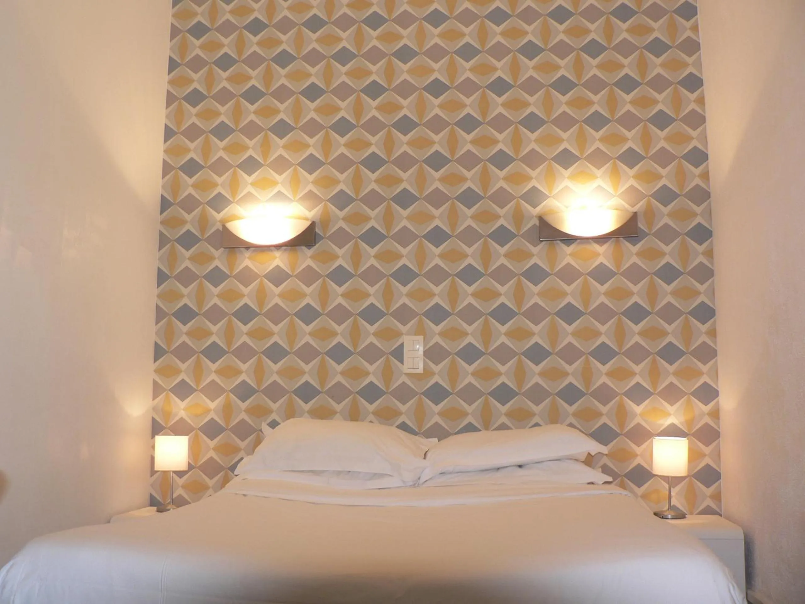 Bed in Hôtel Les Alizés