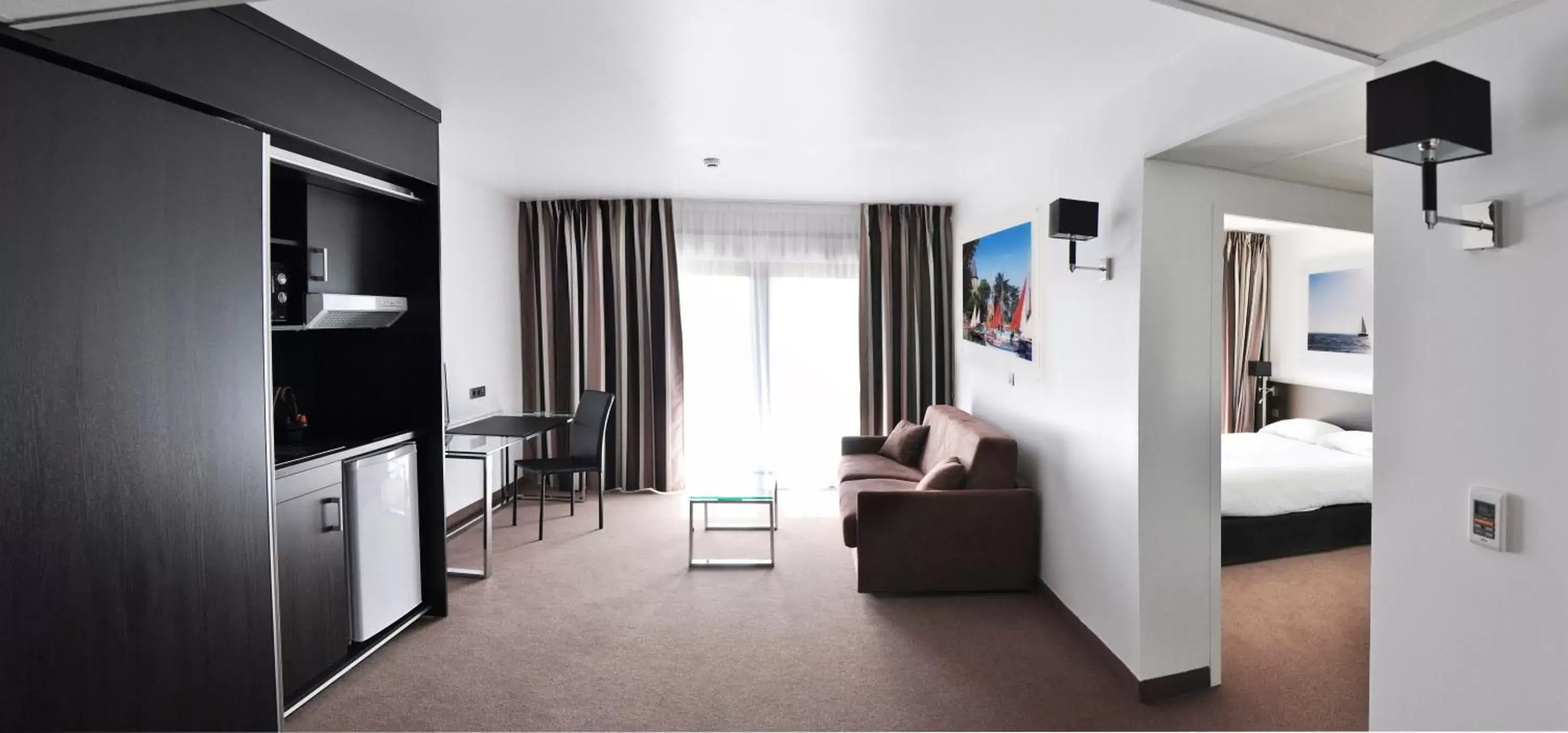 Bedroom, Seating Area in Golden Tulip Pornic Suites