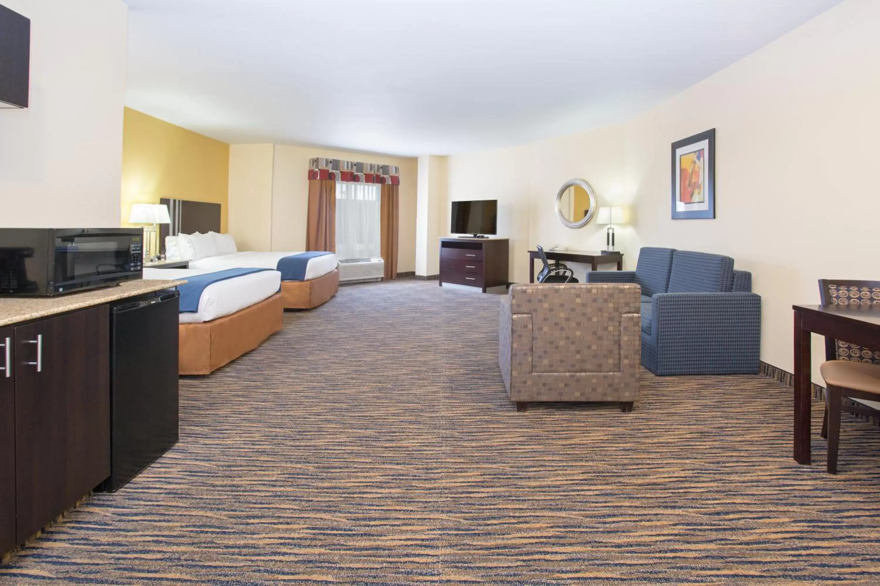 Bedroom, Seating Area in Holiday Inn Express & Suites Denver North - Thornton, an IHG Hotel
