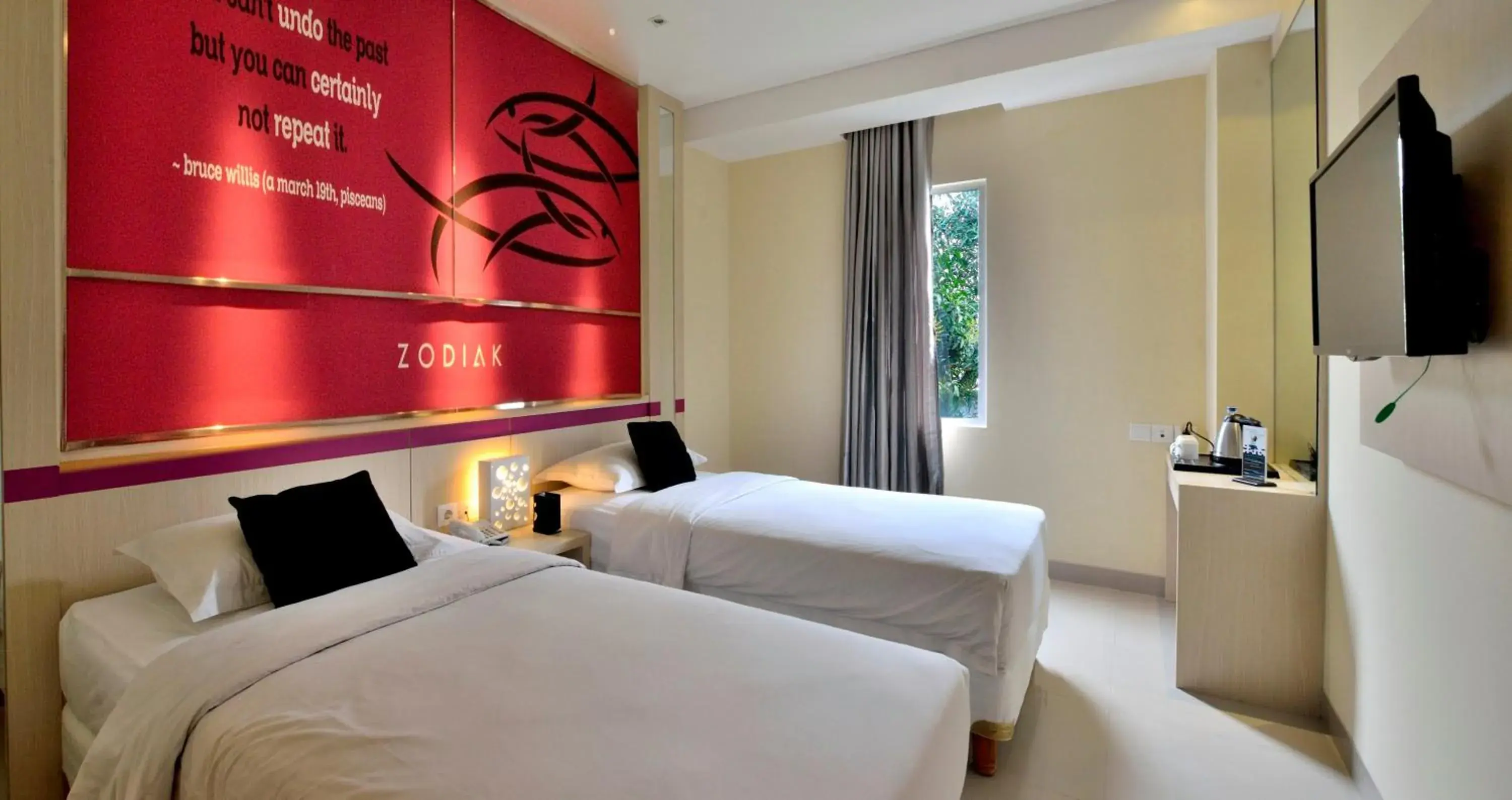 Bed in Zodiak Kebon Kawung by KAGUM Hotels