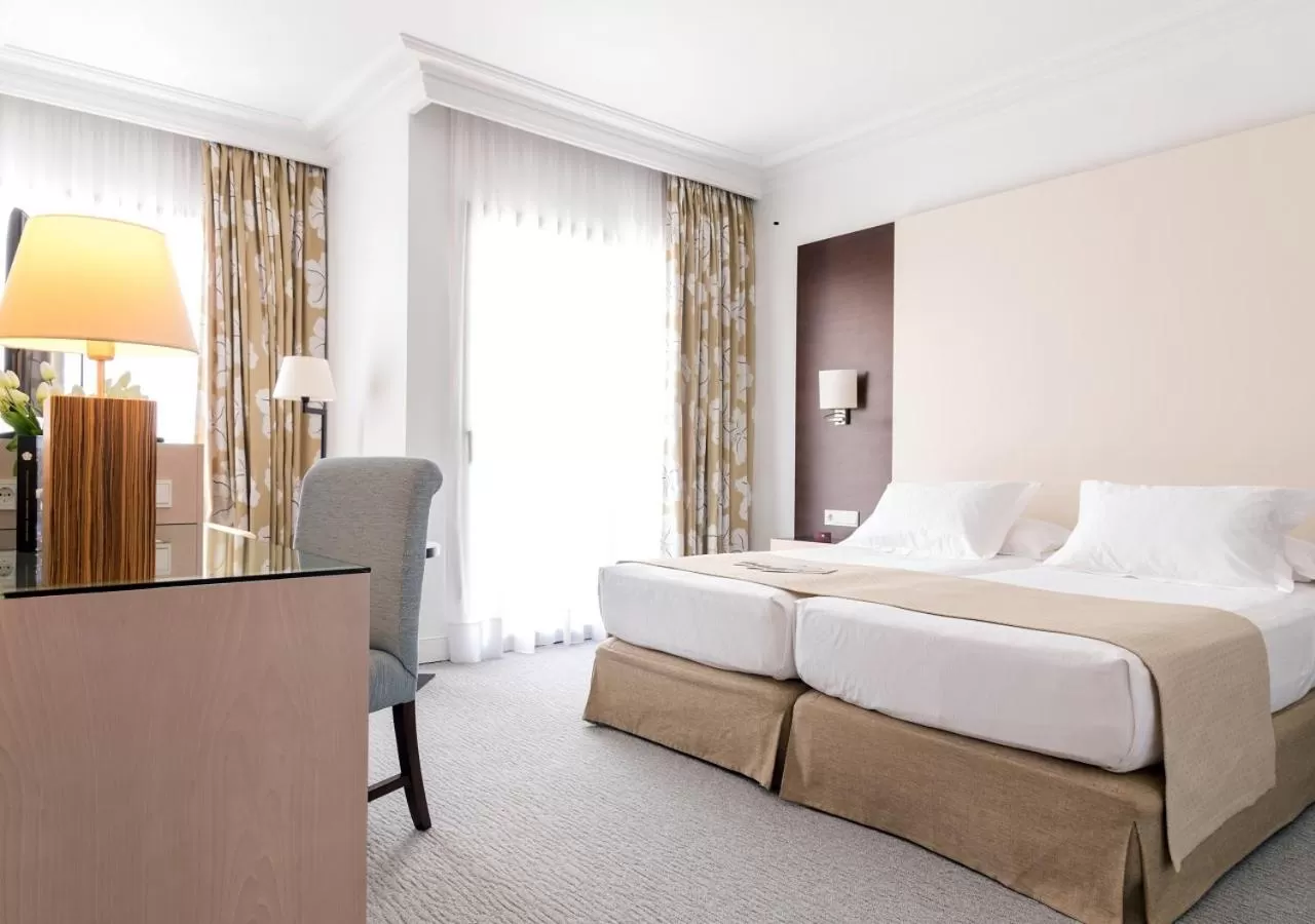 Bed in GPRO Valparaiso Palace & Spa