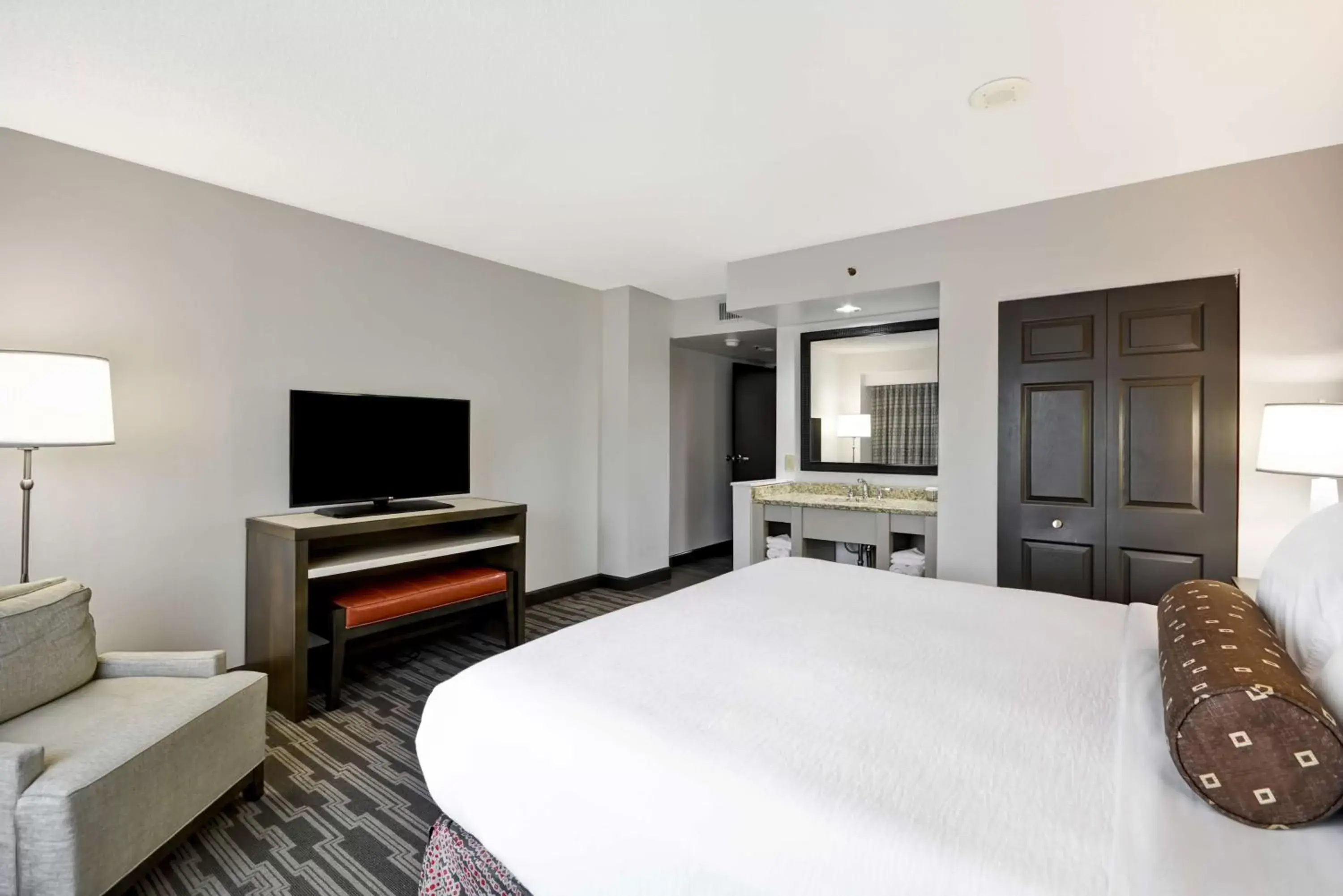 Bed, TV/Entertainment Center in Embassy Suites Charlotte