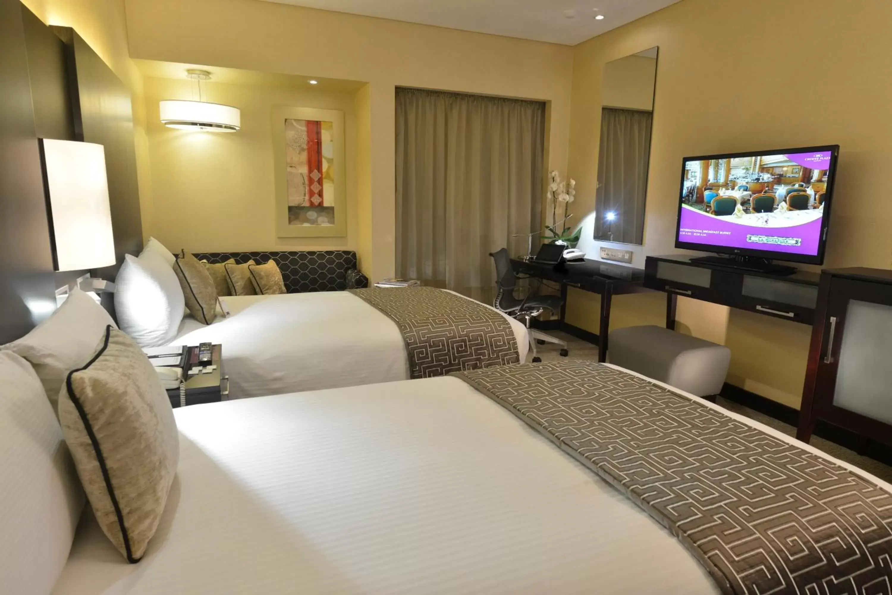 Photo of the whole room, Bed in Crowne Plaza Bahrain, an IHG Hotel