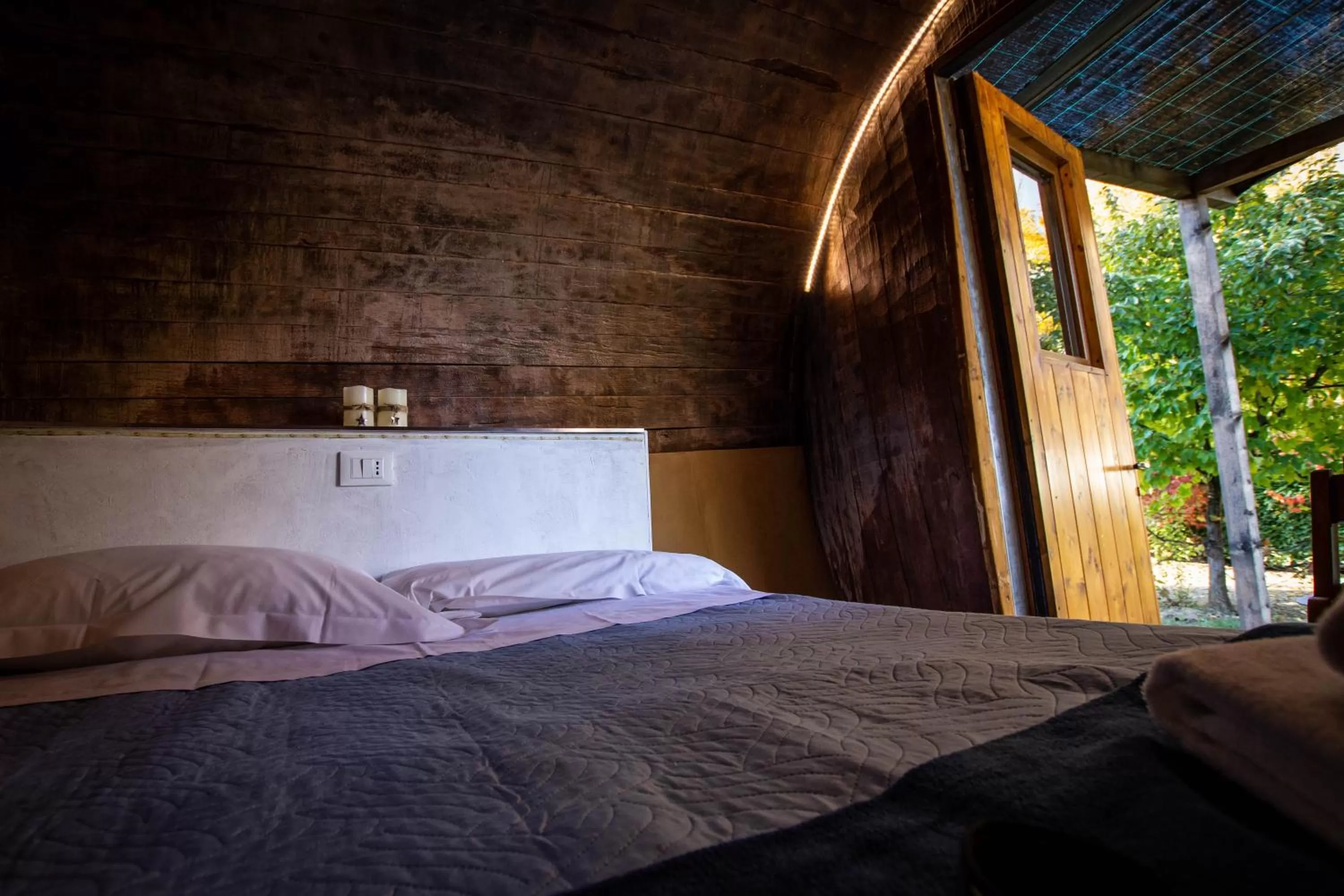 Bed in AgriCamping AlbaVillage Hotel & Wellness