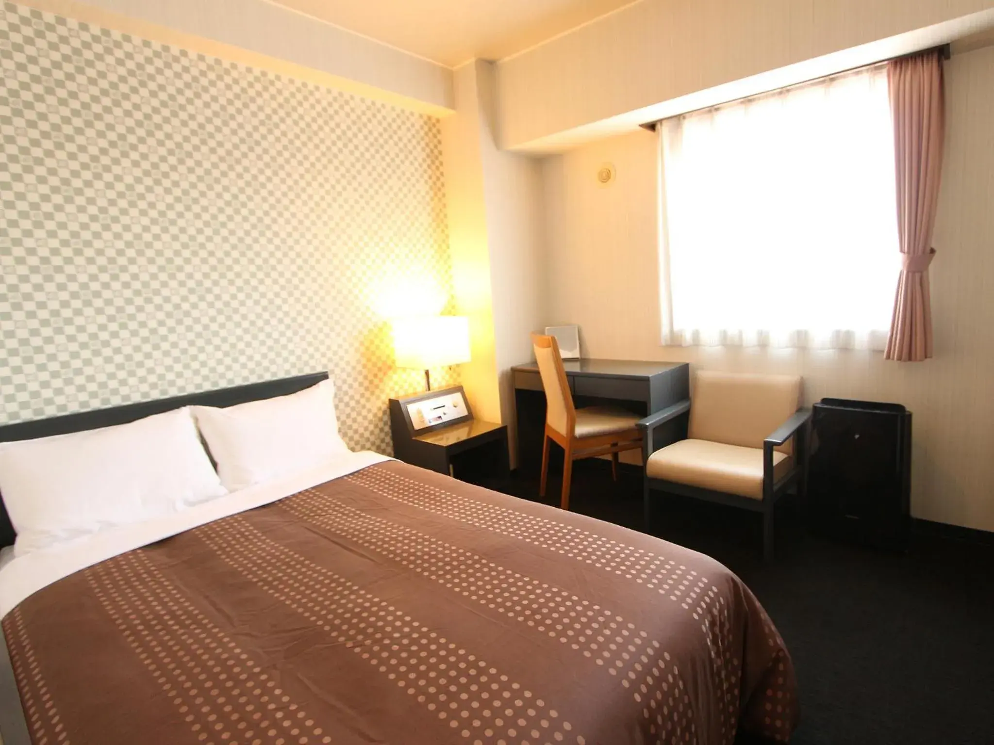 Bed in HOTEL LiVEMAX BUDGET Chitose