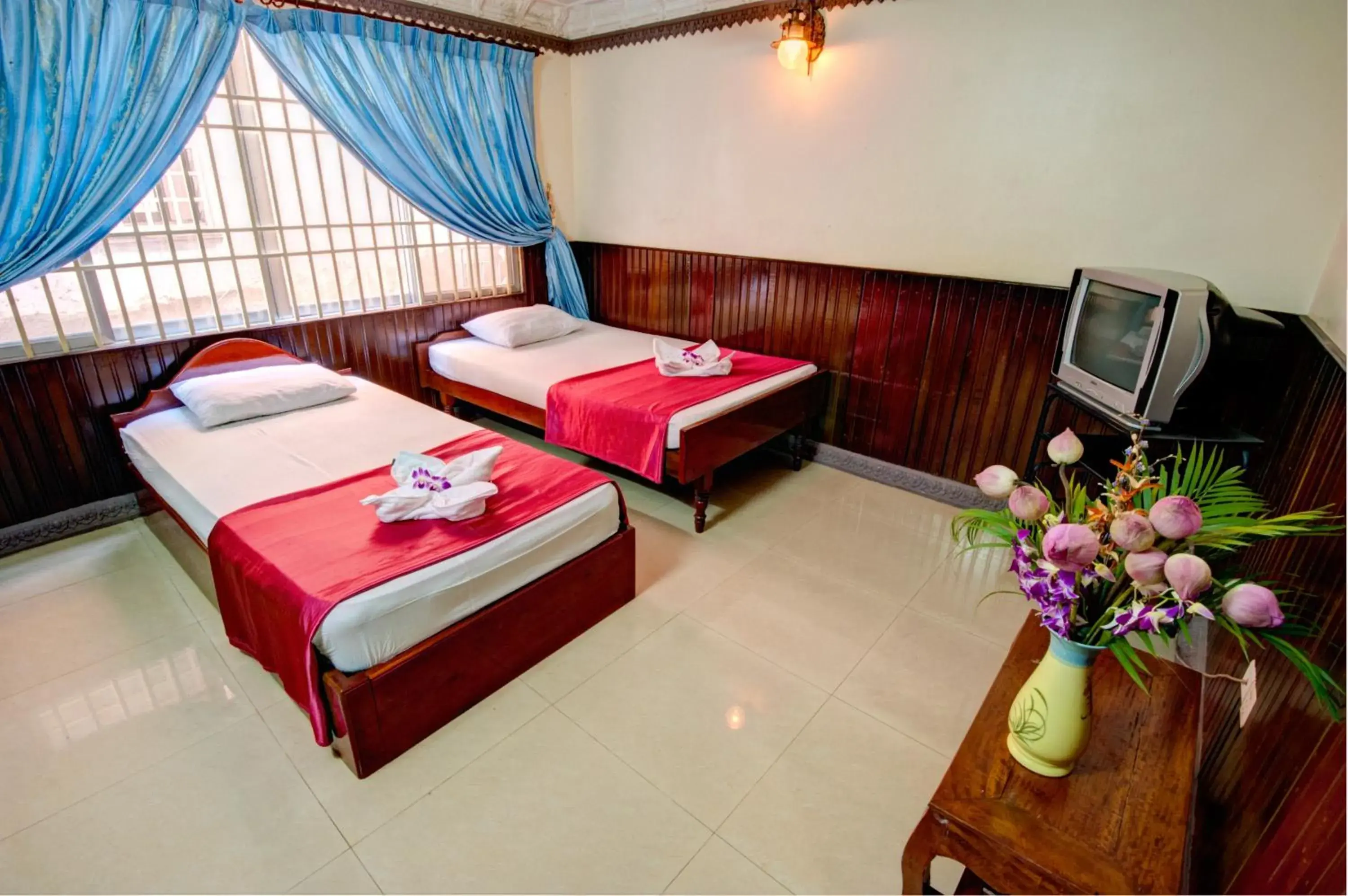 Bed in Okay Guesthouse Phnom Penh