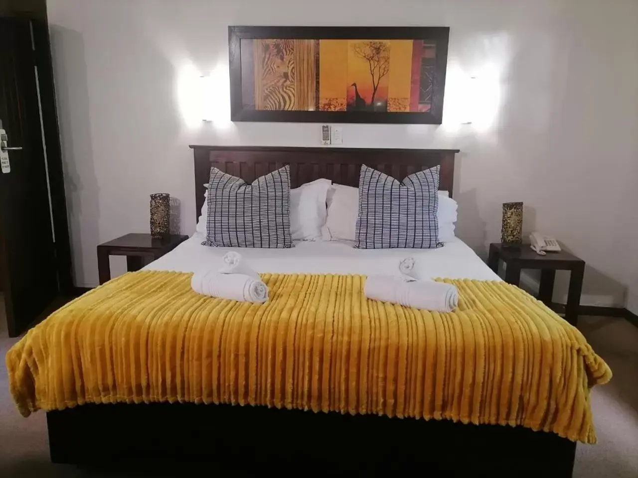Bed in Hotel Numbi & Garden Suites