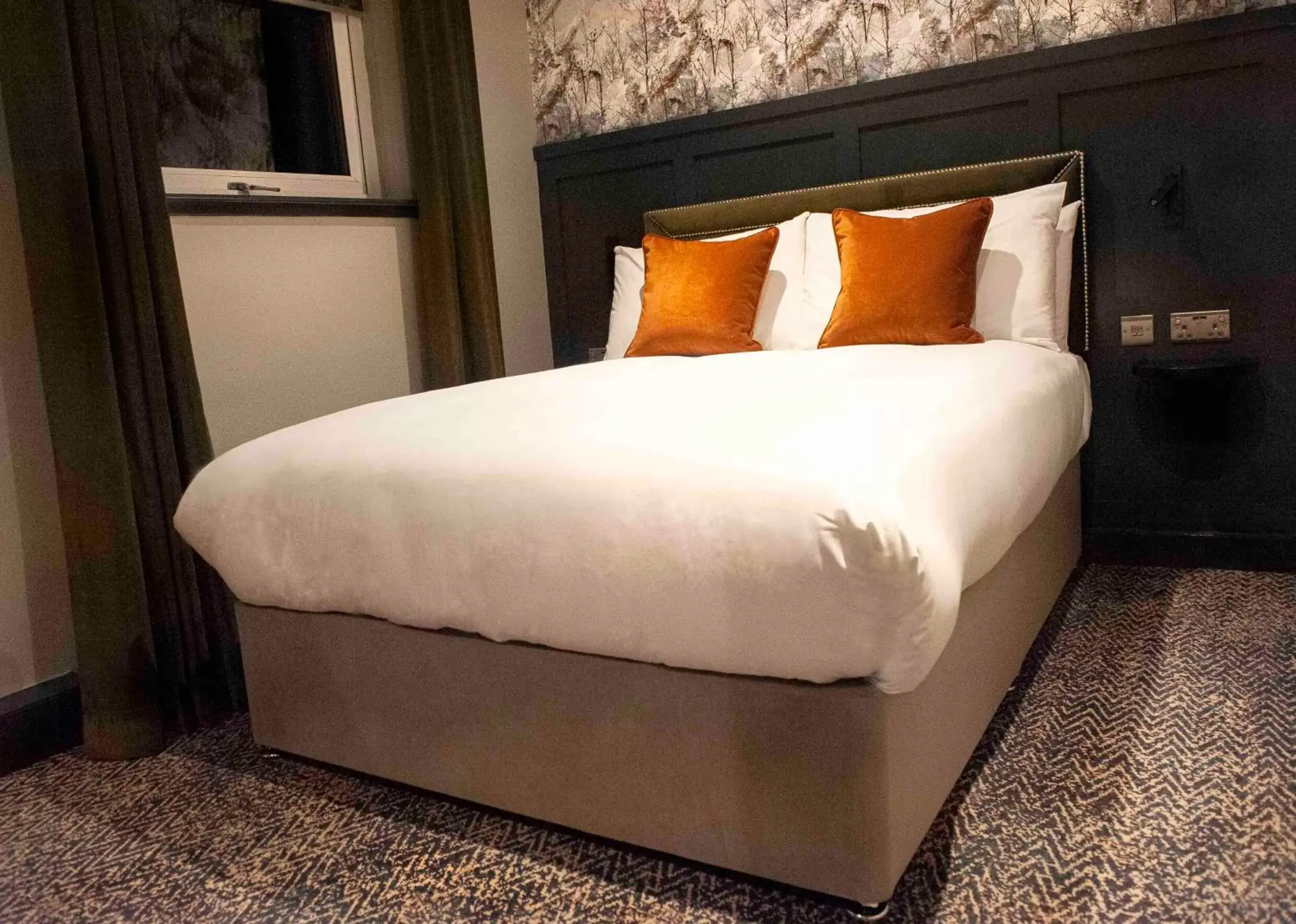 Bed in The Coachman Hotel Bed in The Coachman Hotel