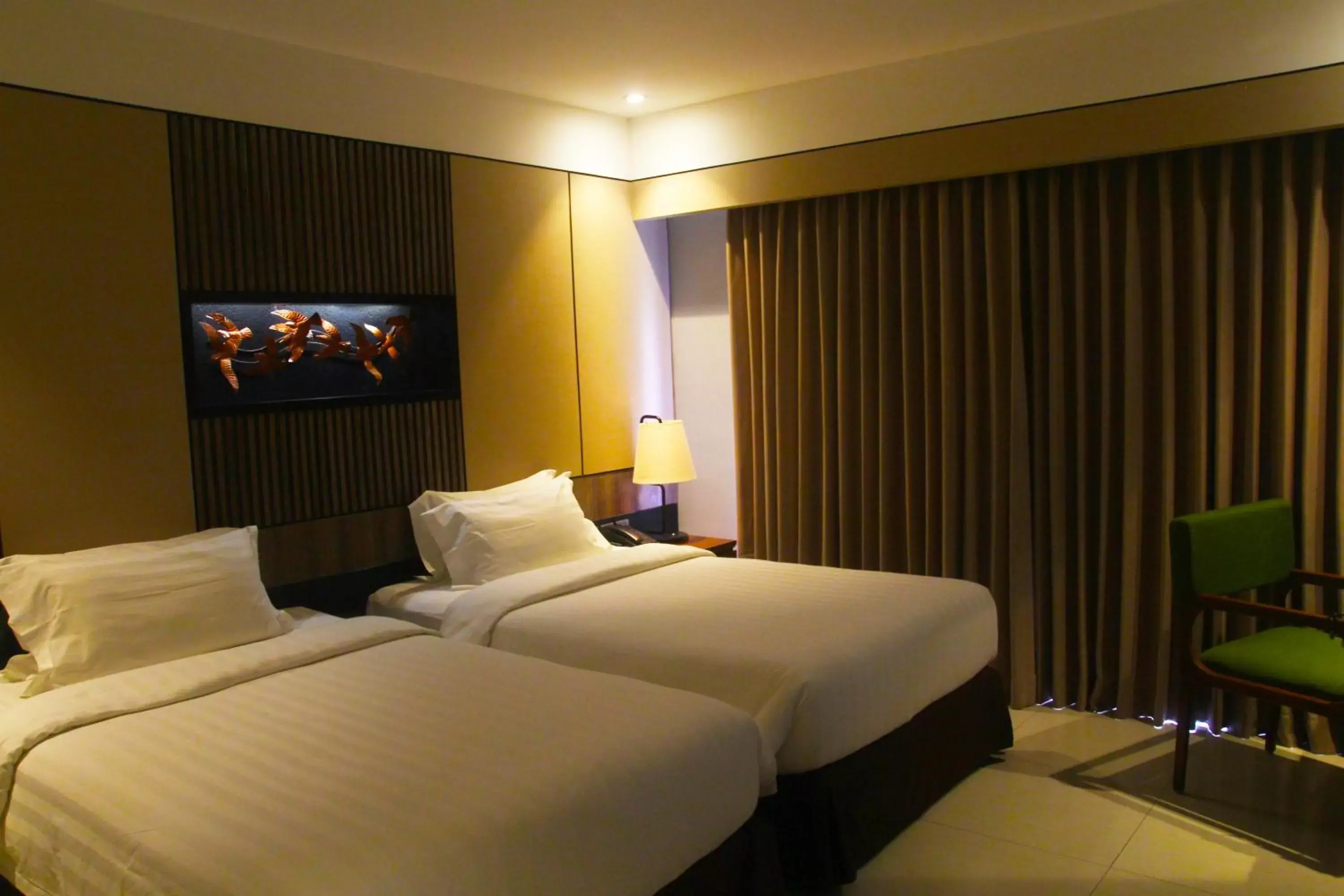 Bed in The Nest Hotel Nusa Dua