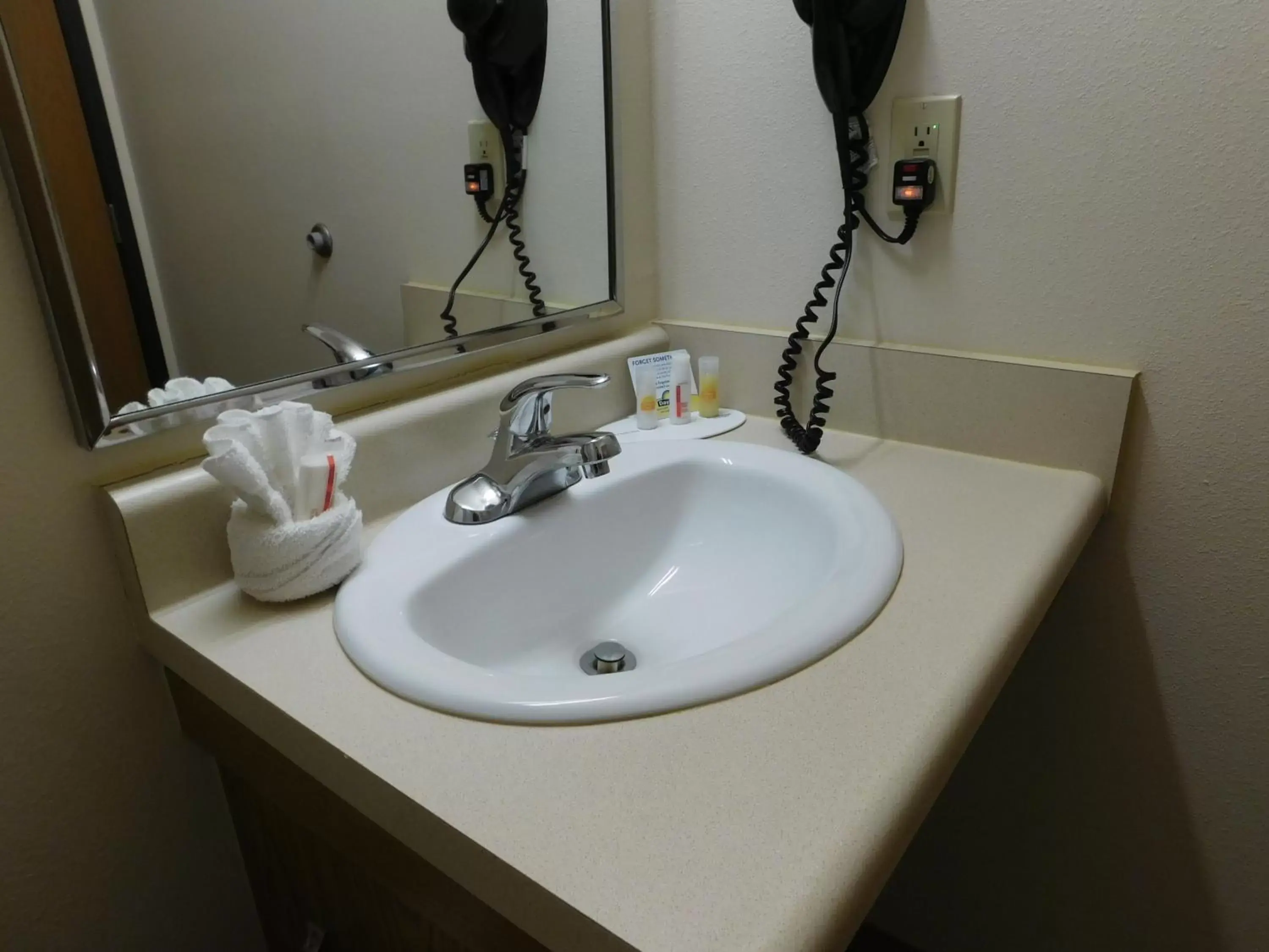 Bathroom in Days Inn & Suites by Wyndham Rochester South