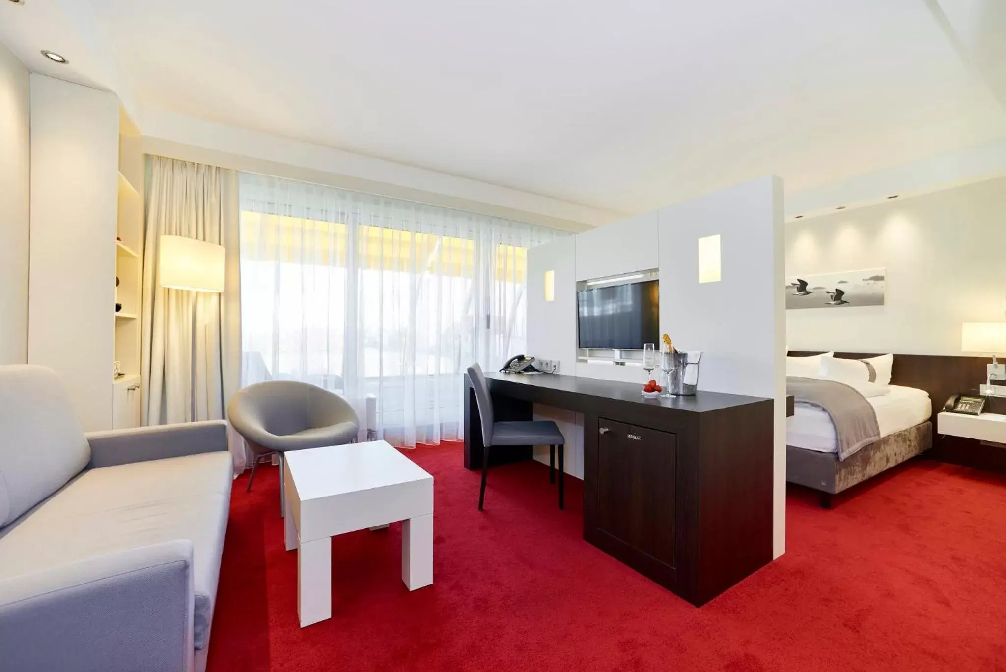 Bedroom, Seating Area in Holiday Inn Berlin Airport - Conference Centre, an IHG Hotel