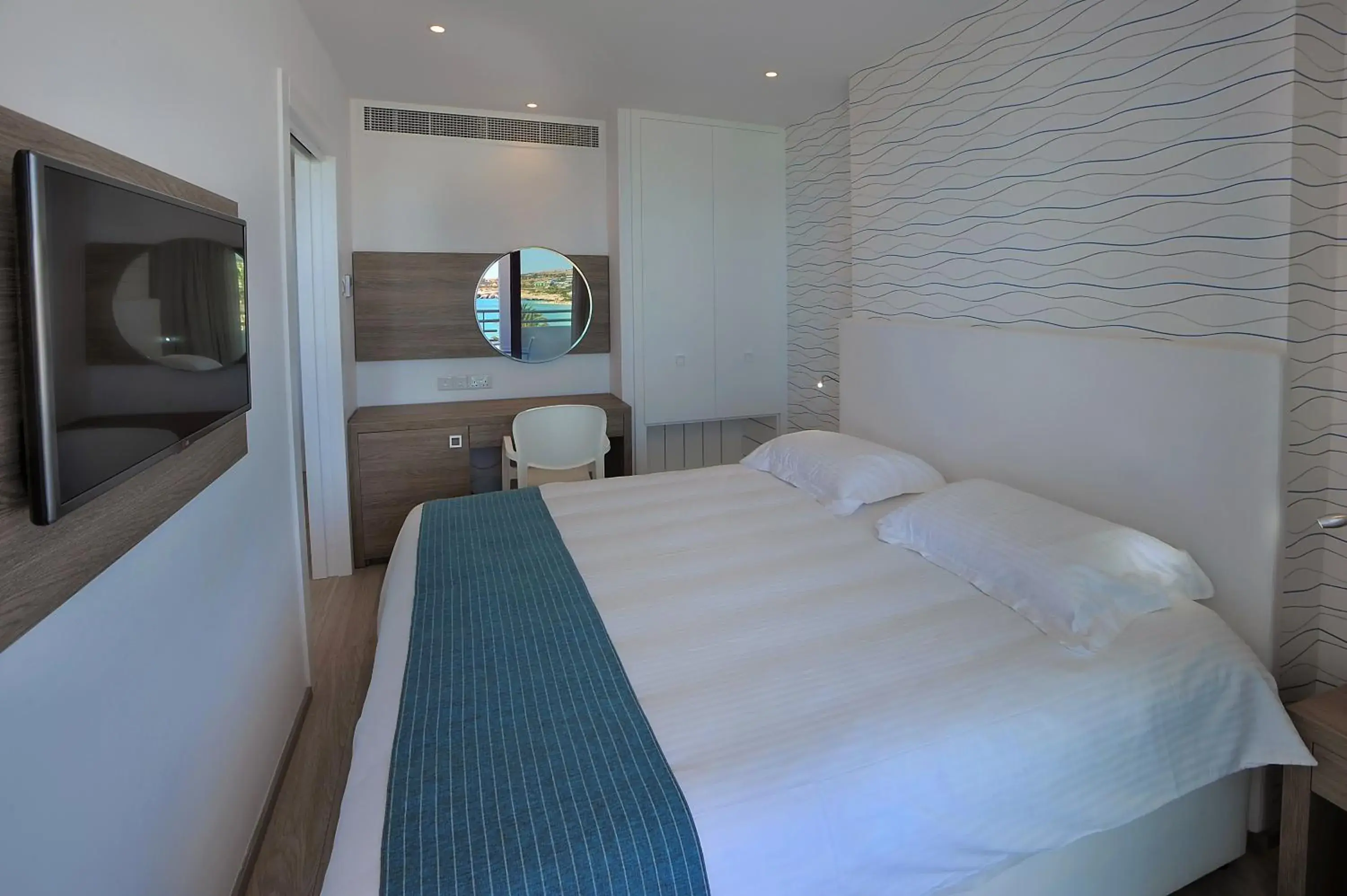 Bed in Okeanos Beach Boutique Hotel