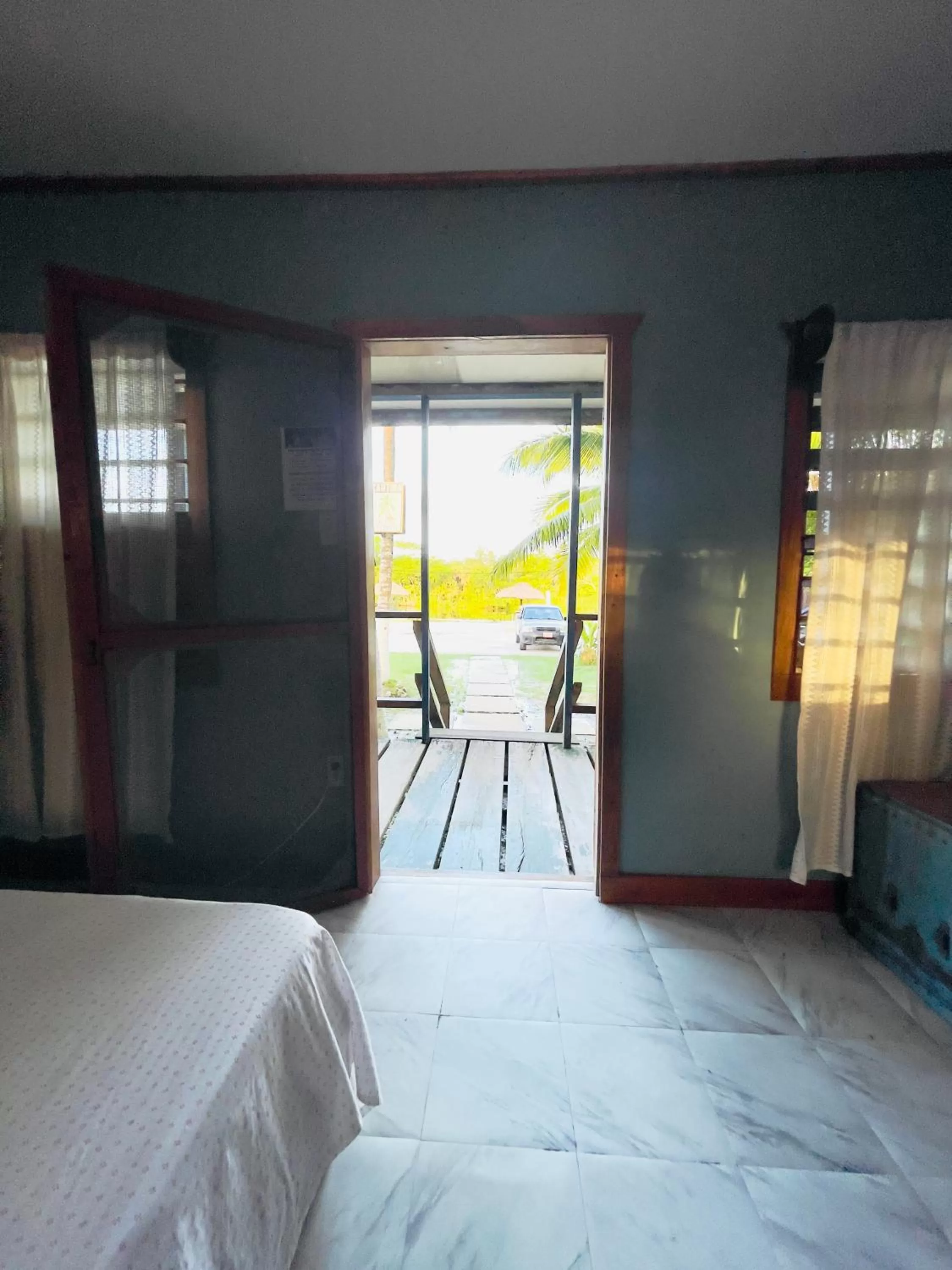 Bed in Lamanai Riverside Retreat