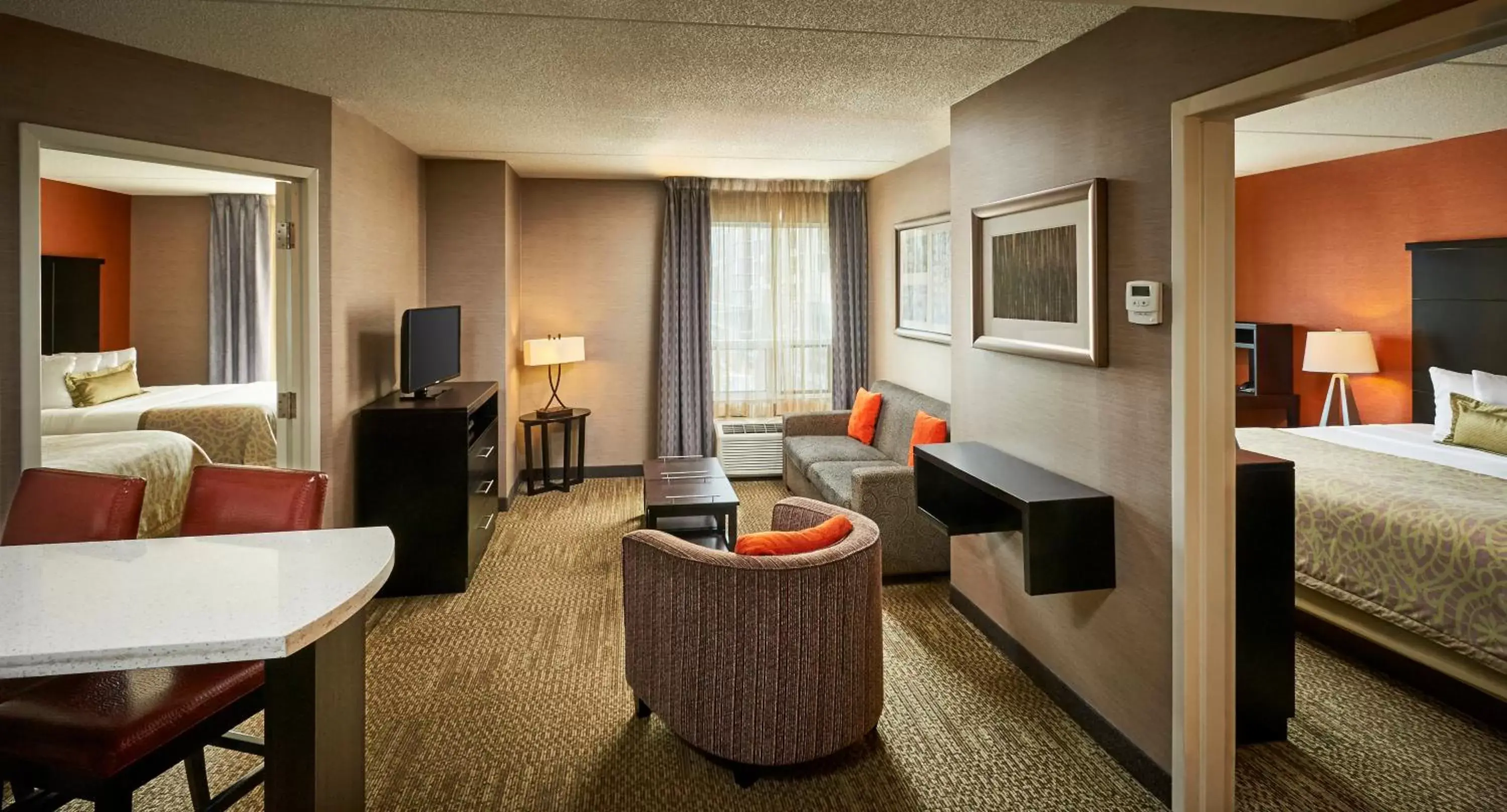 Photo of the whole room, Seating Area in Staybridge Suites Hamilton - Downtown, an IHG Hotel