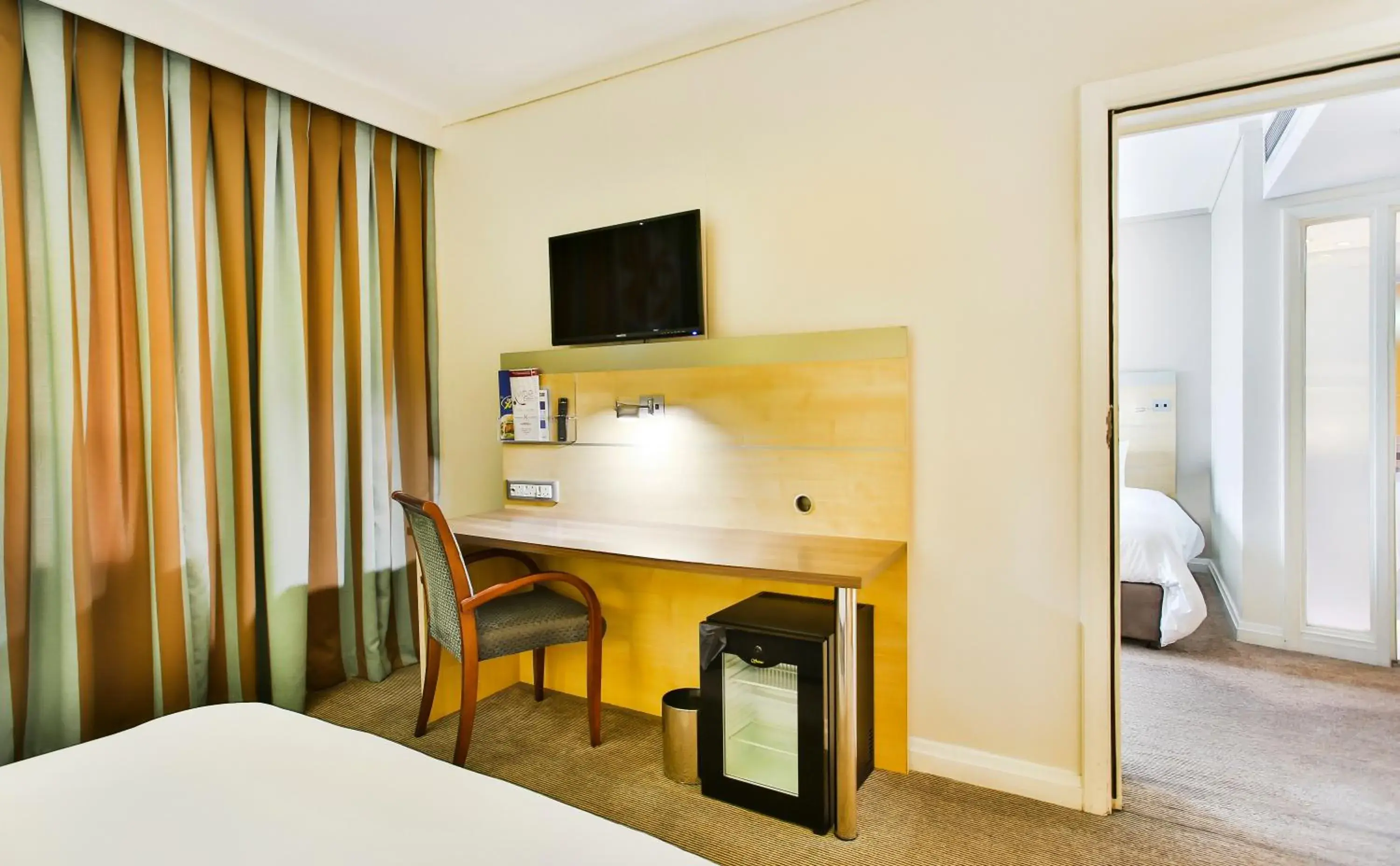 Photo of the whole room, TV/Entertainment Center in Holiday Inn Express Sandton-Woodmead, an IHG Hotel