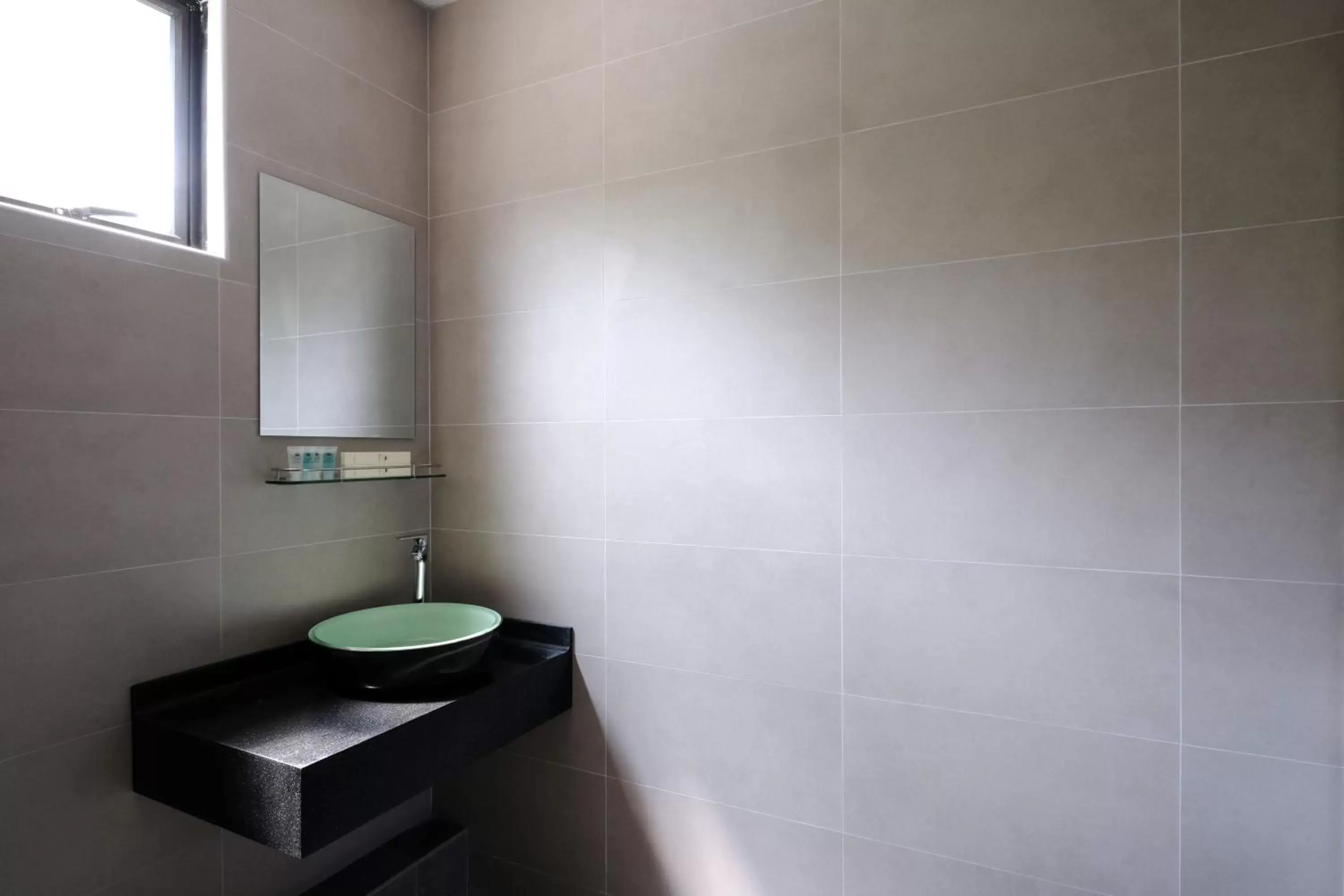 Bathroom in Q Loft Hotels at Bedok