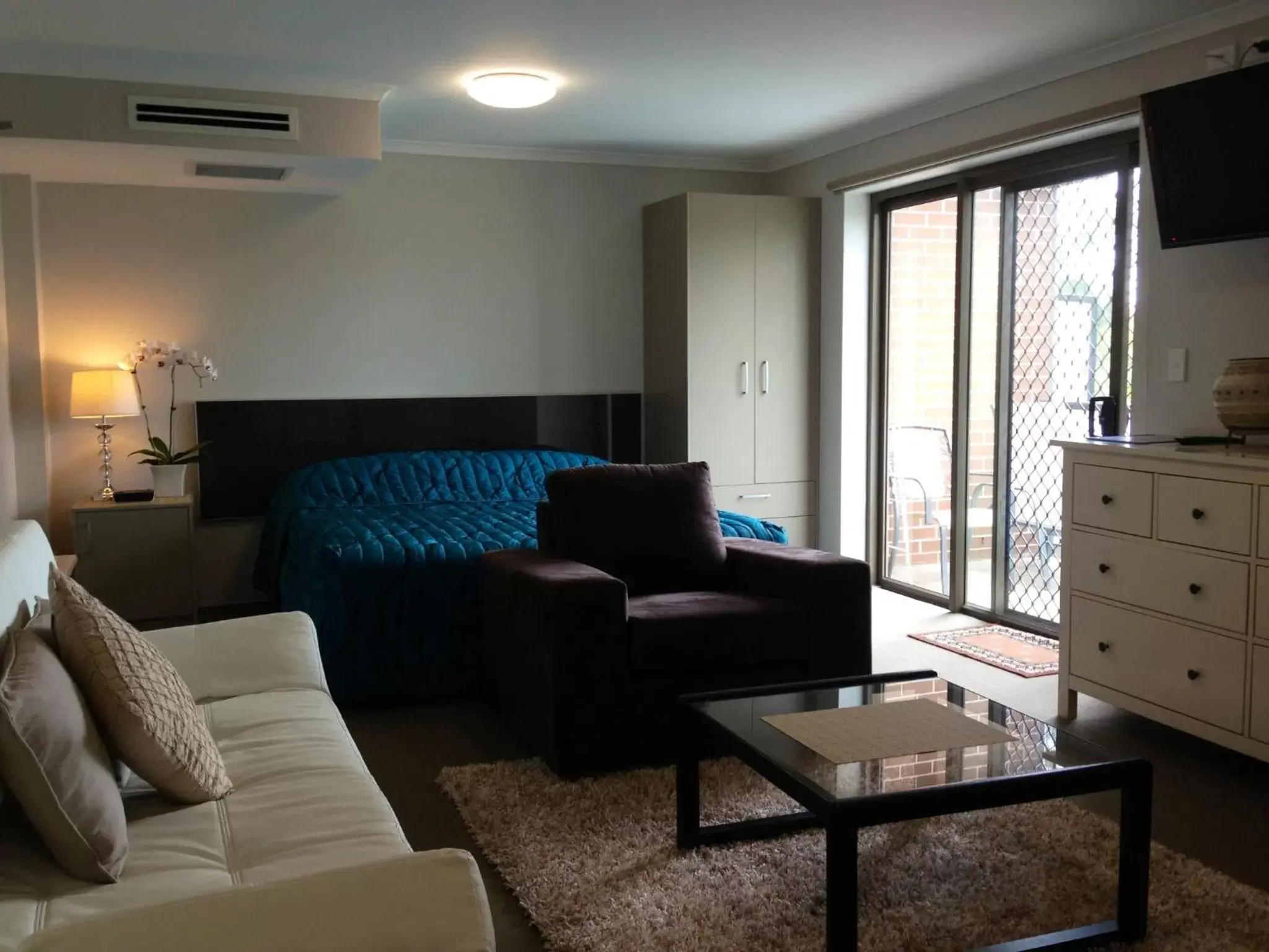 Bed, Seating Area in Strathfield Executive Accommodation