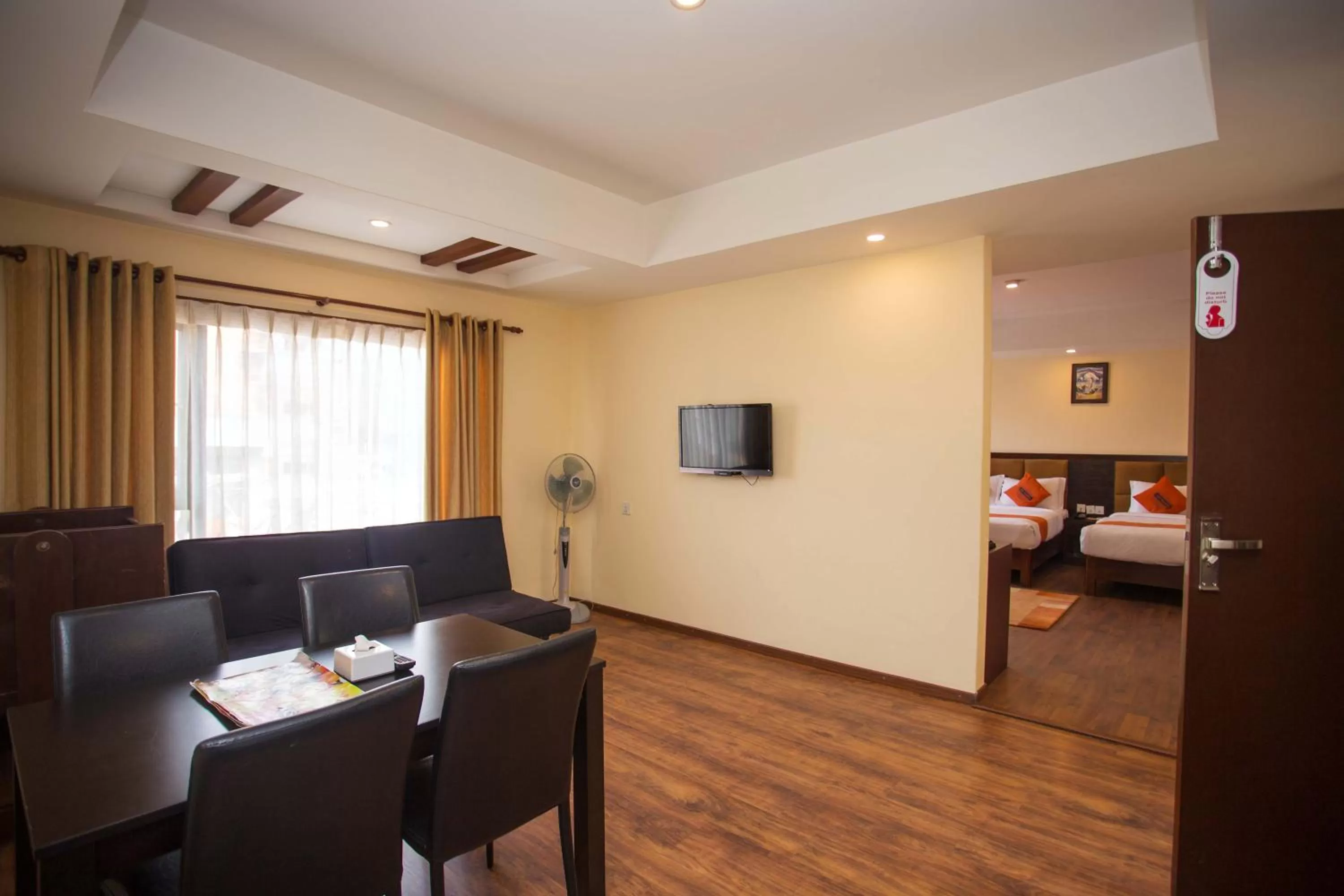 Living room, Bed in Hotel Jay Suites