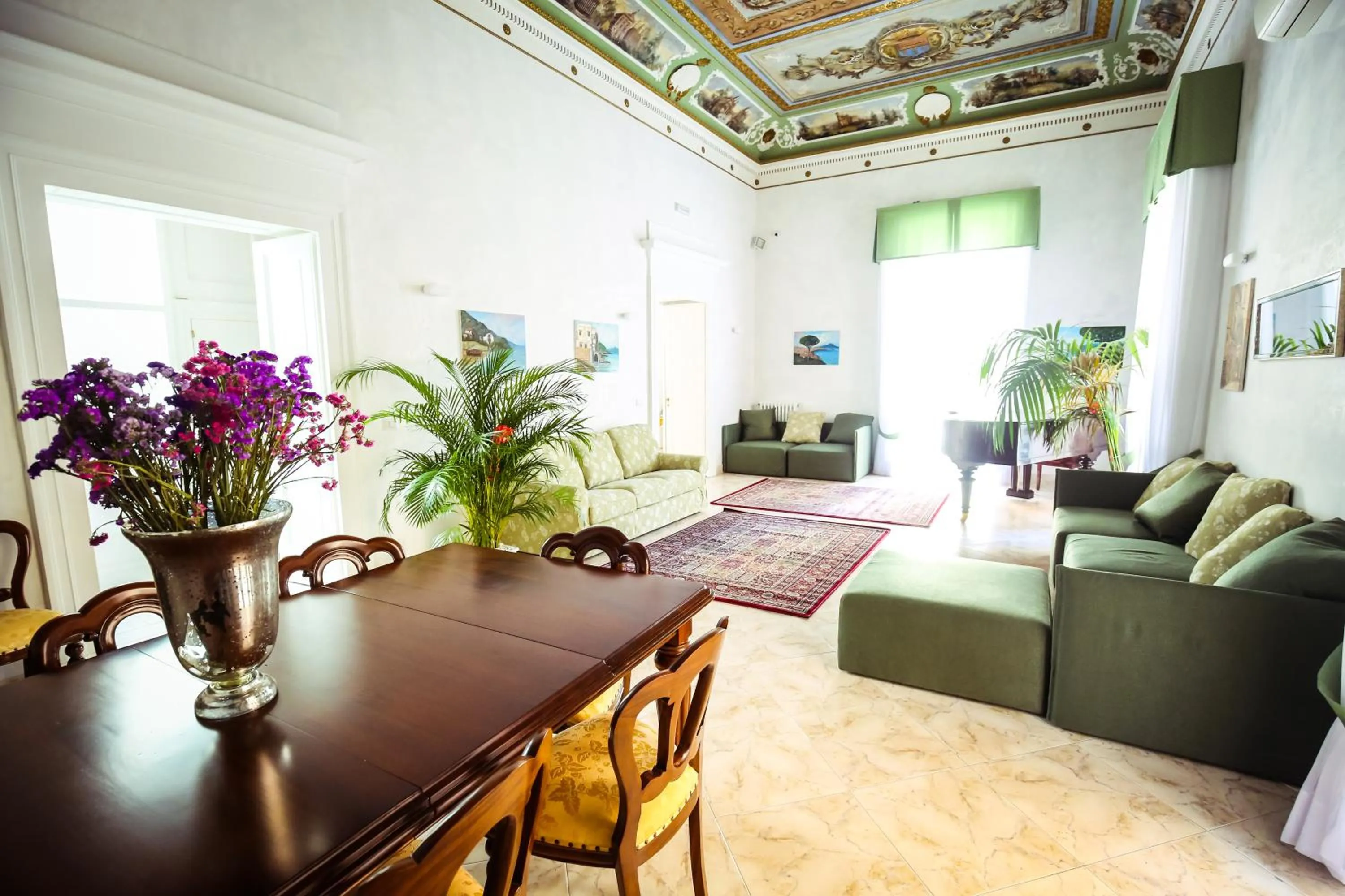 Communal lounge/ TV room in NapoliMia Boutique Hotel