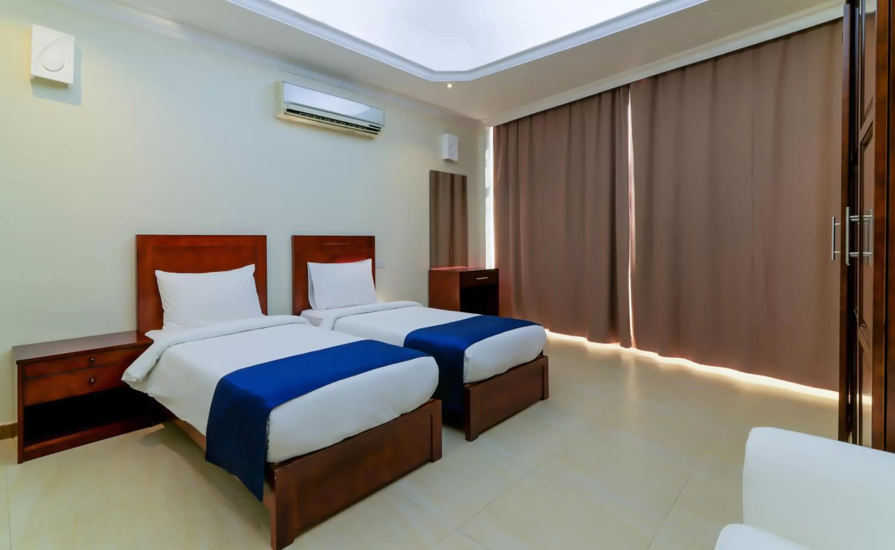 Bedroom, Bed in Tanzanite Executive Suites