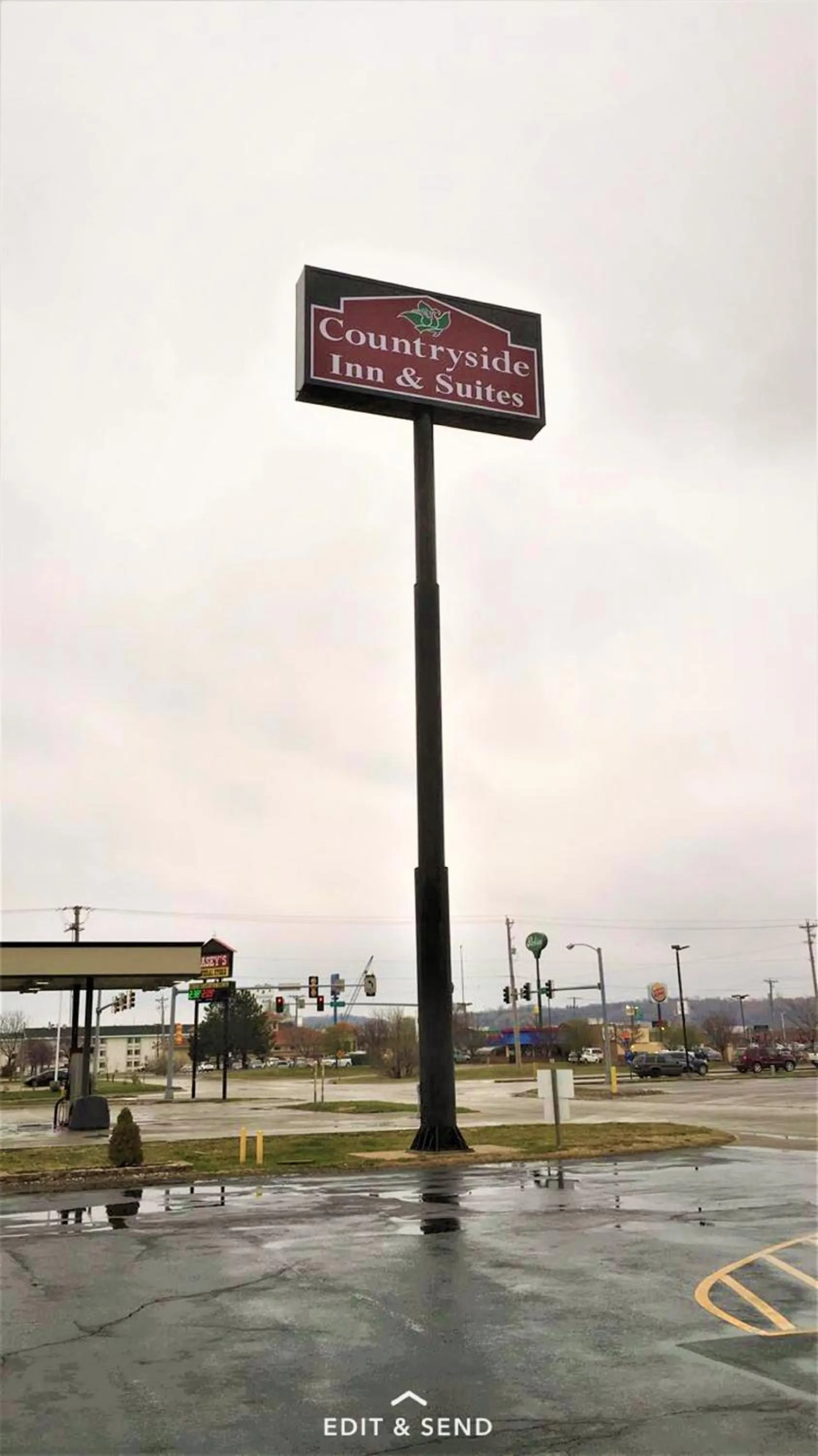 Property logo or sign in Countryside Inn & Suites Omaha East-Council Bluffs IA