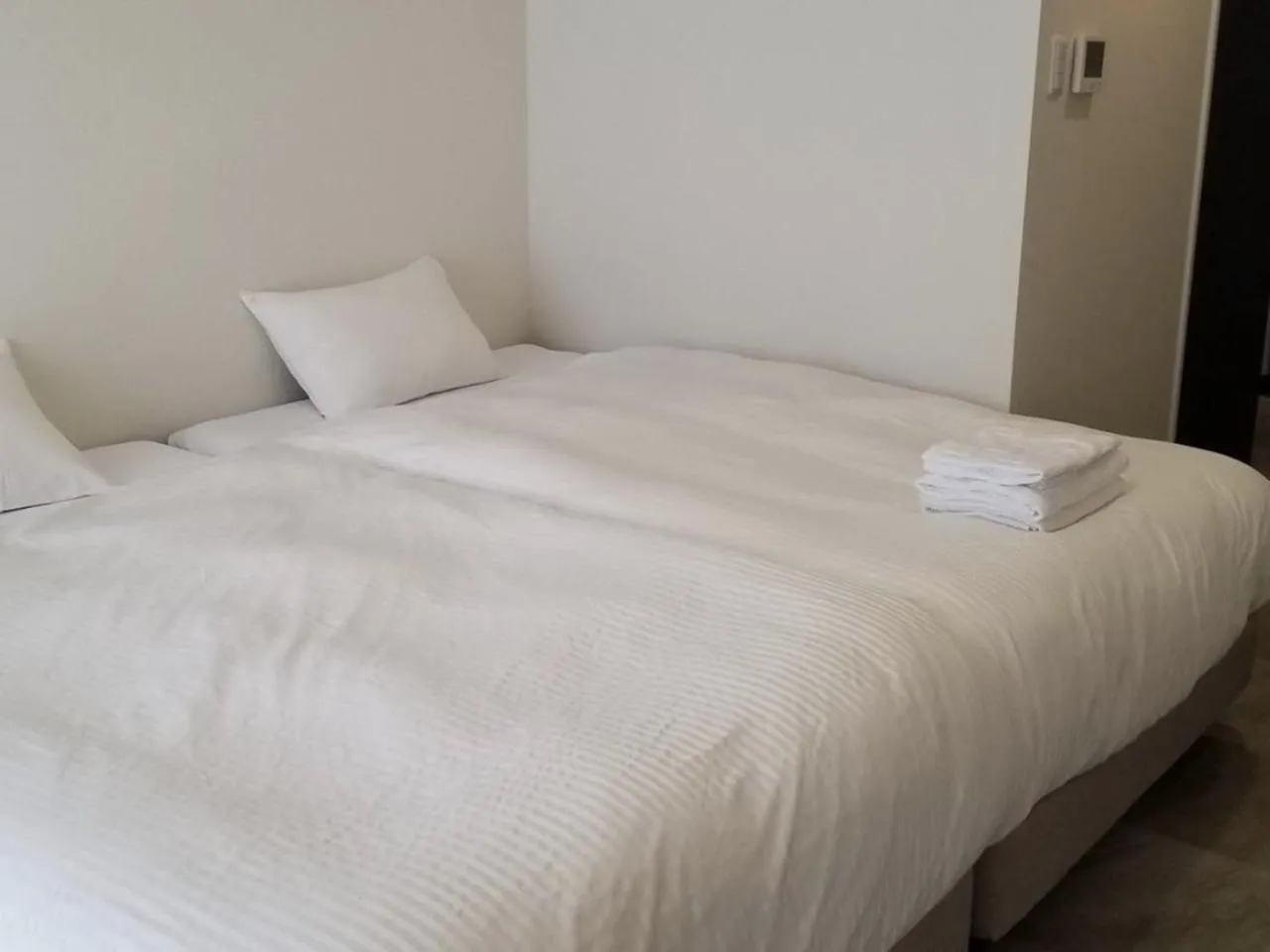 Photo of the whole room, Bed in MrKINJO in Nicas Makishi