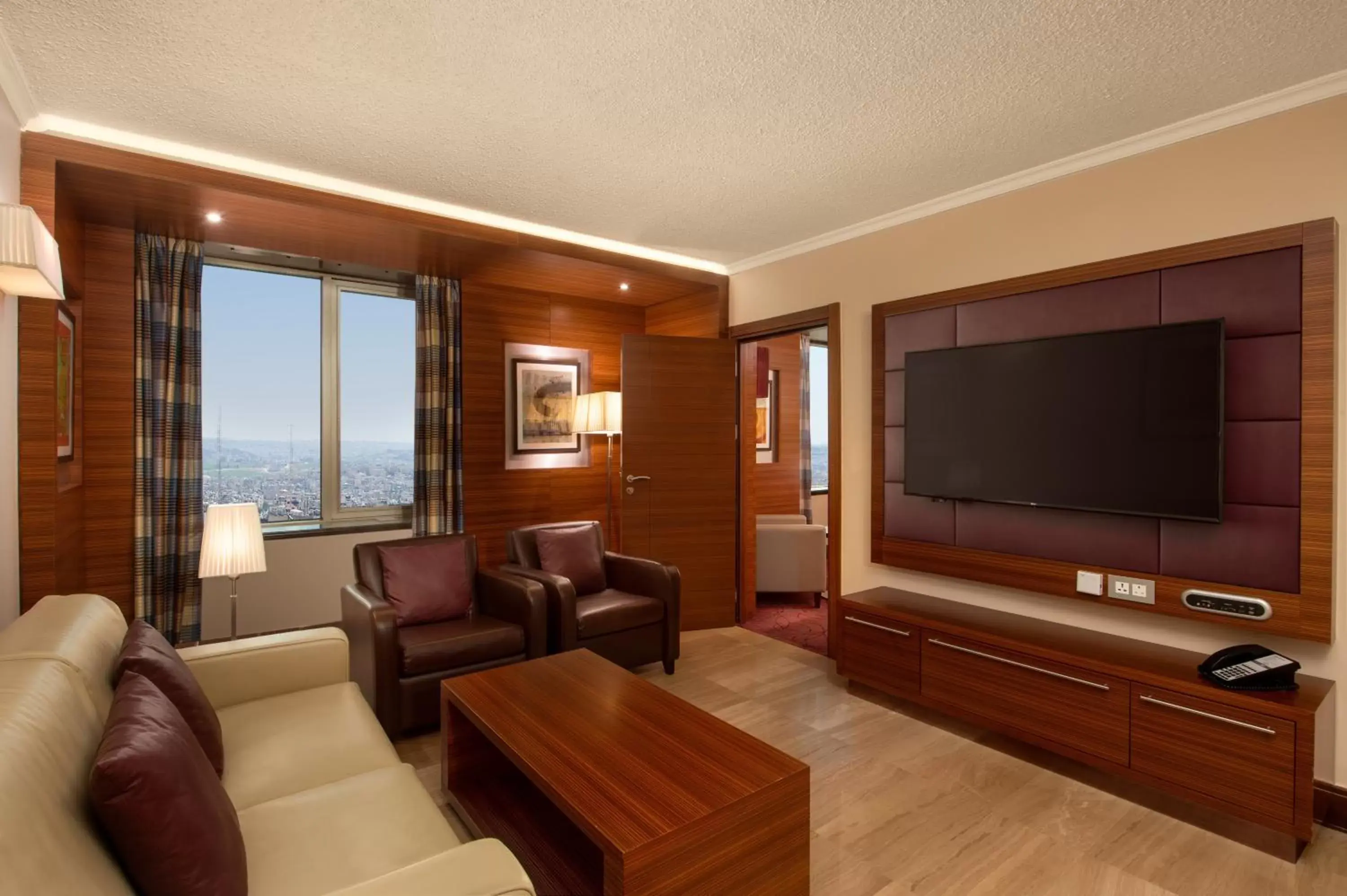 Photo of the whole room, TV/Entertainment Center in Crowne Plaza Amman, an IHG Hotel