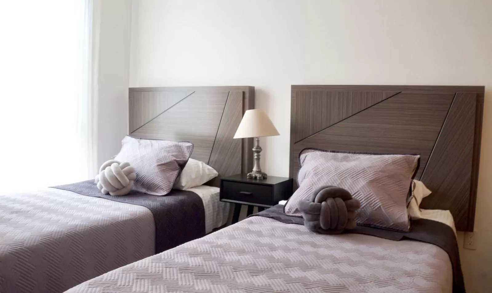 Bed in Metropolitan Suites