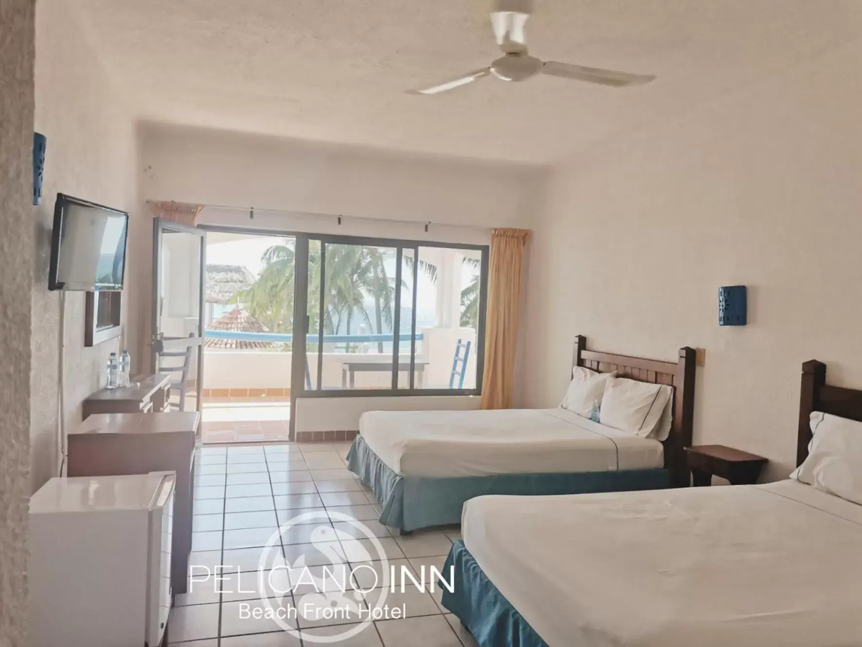 Photo of the whole room in Pelicano Inn Playa del Carmen - Beachfront Hotel