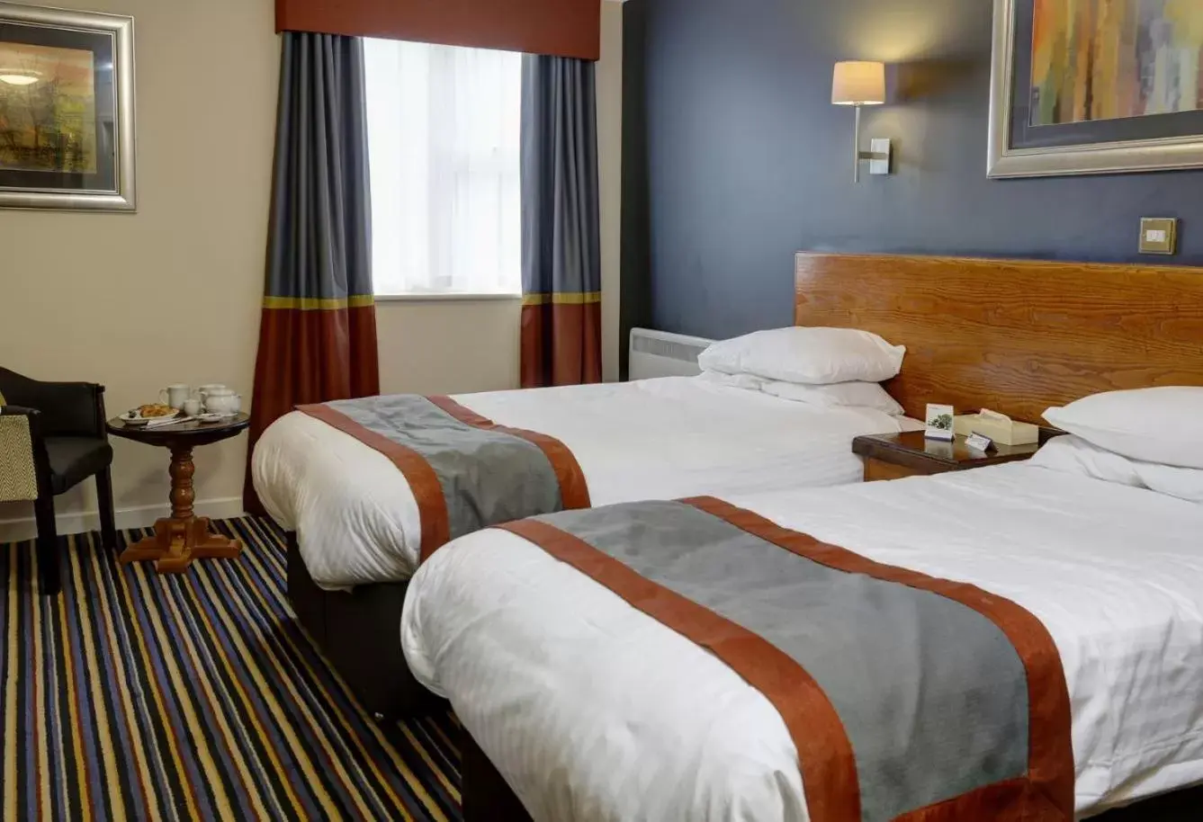 Bed in Weathervane Hotel by Greene King Inns
