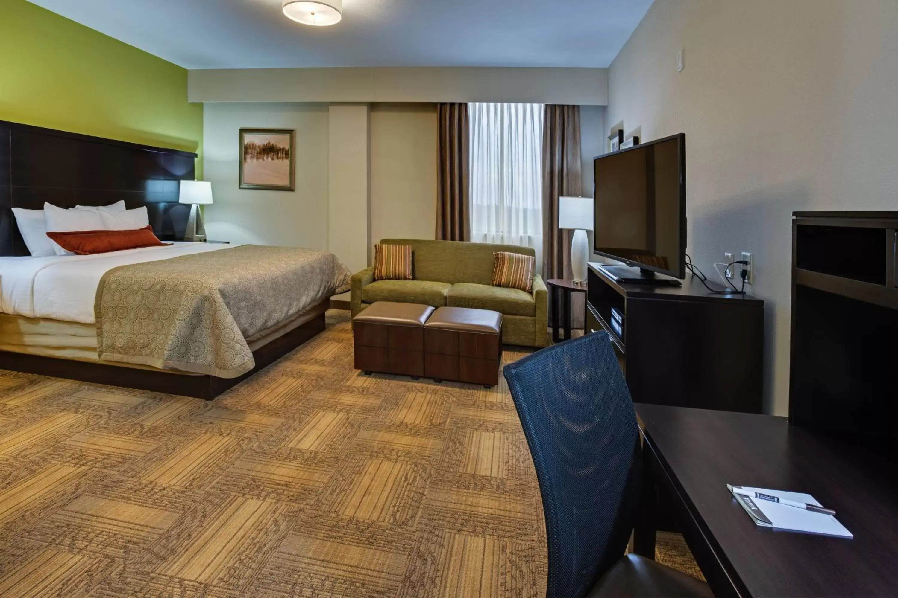 Photo of the whole room, TV/Entertainment Center in Staybridge Suites Atlanta Airport