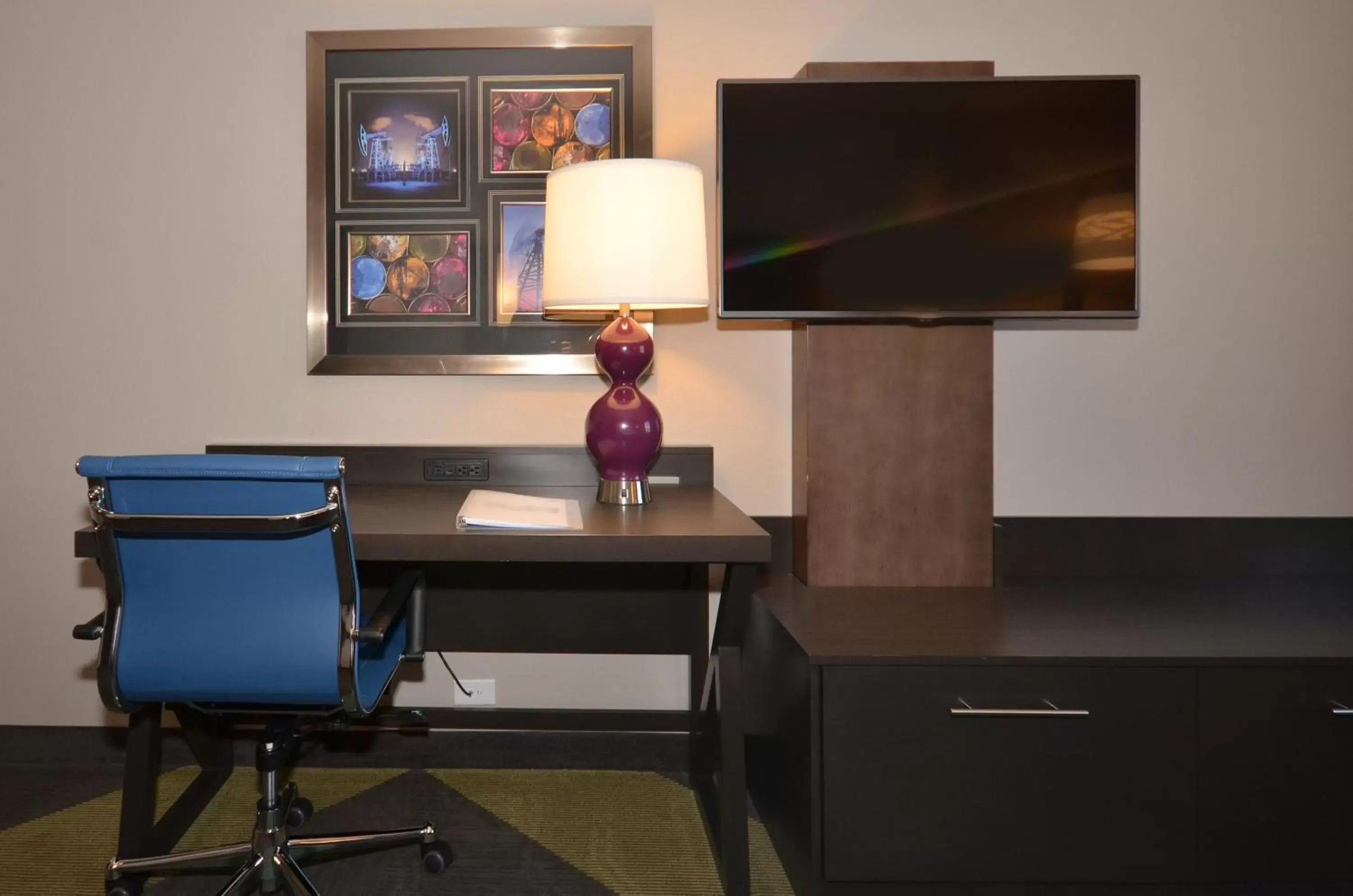 Photo of the whole room, TV/Entertainment Center in Holiday Inn Express & Suites Oklahoma City Mid - Arpt Area, an IHG Hotel