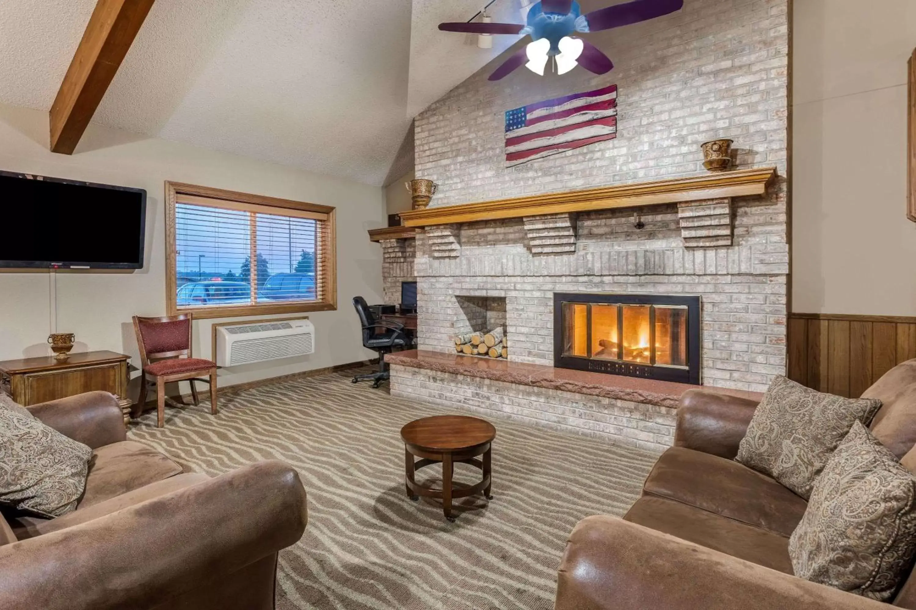 Lobby or reception, Seating Area in AmericInn by Wyndham Monroe