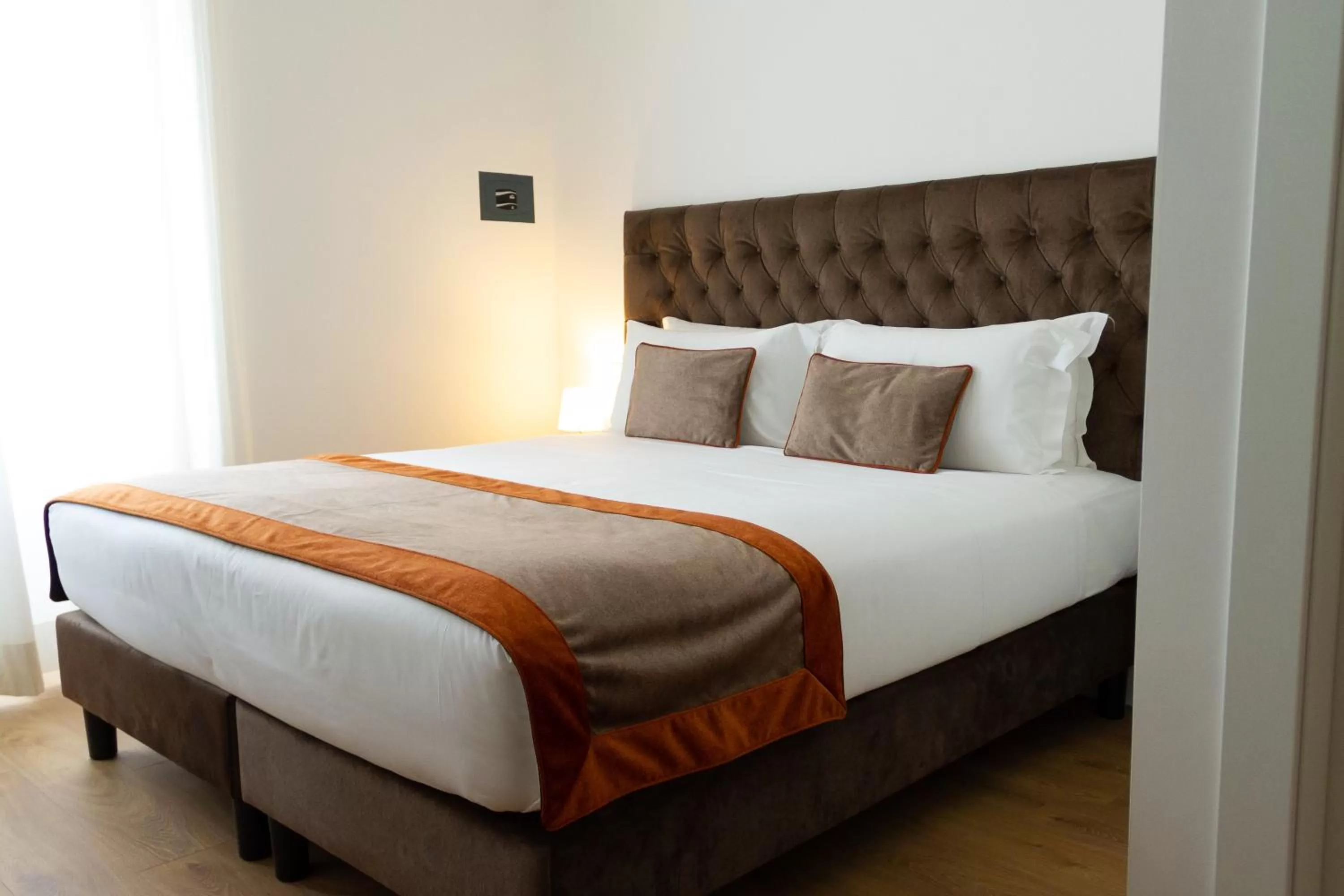 Bed in Michelangelo Vatican Rooms