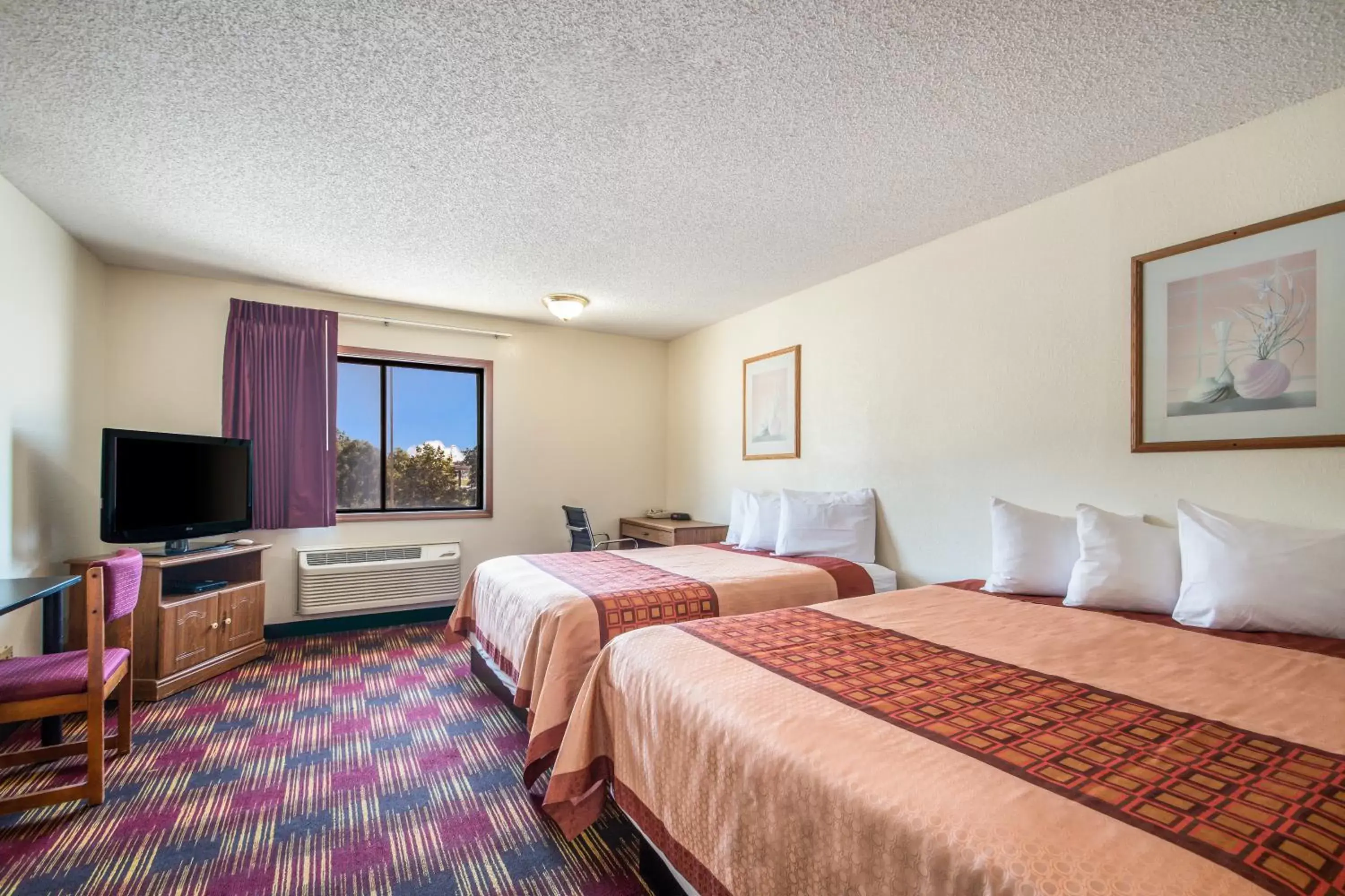 Bed in Americas Best Value Inn & Suites Harrisonville