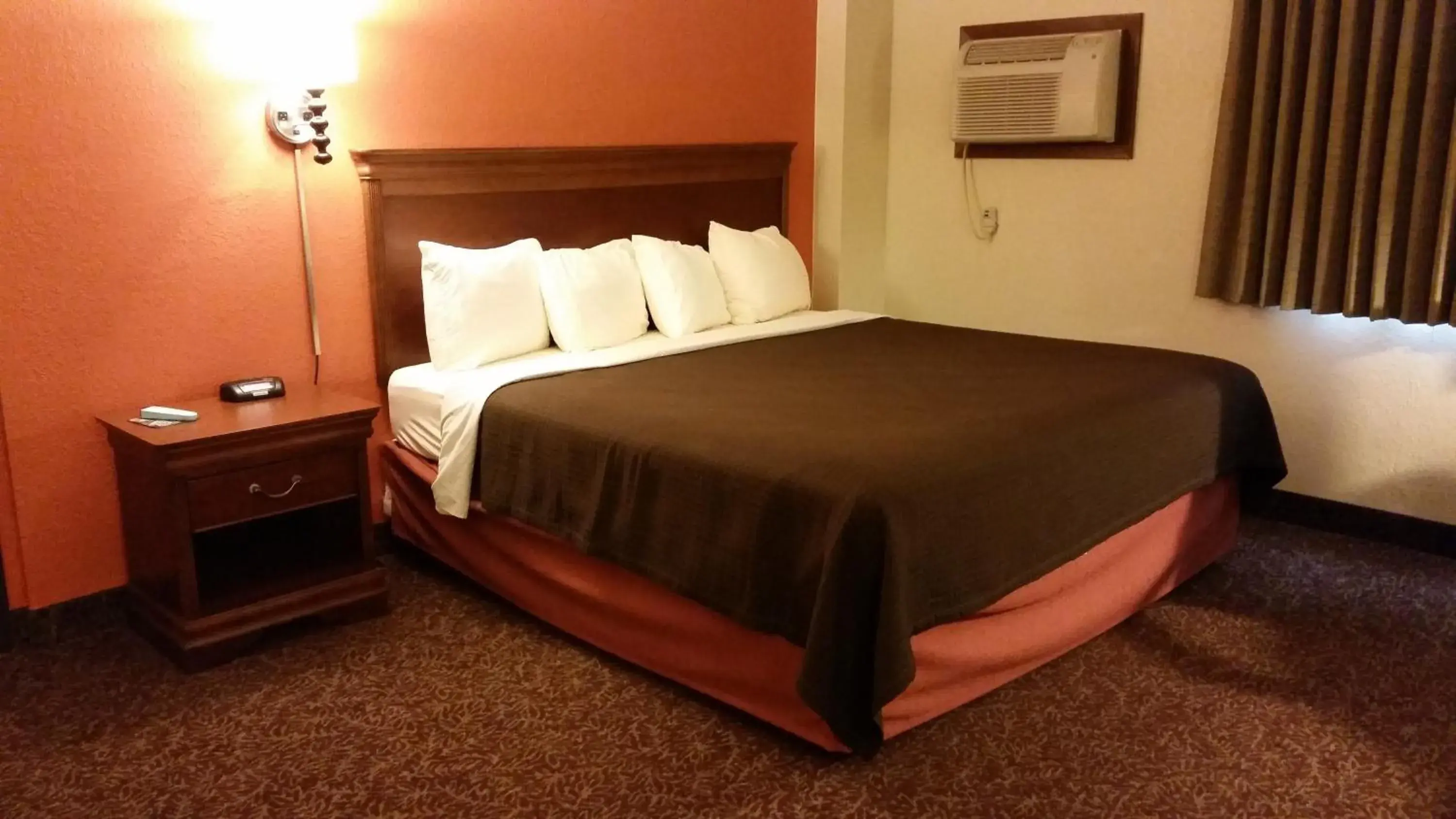 Bed in AmericInn by Wyndham Forest Lake