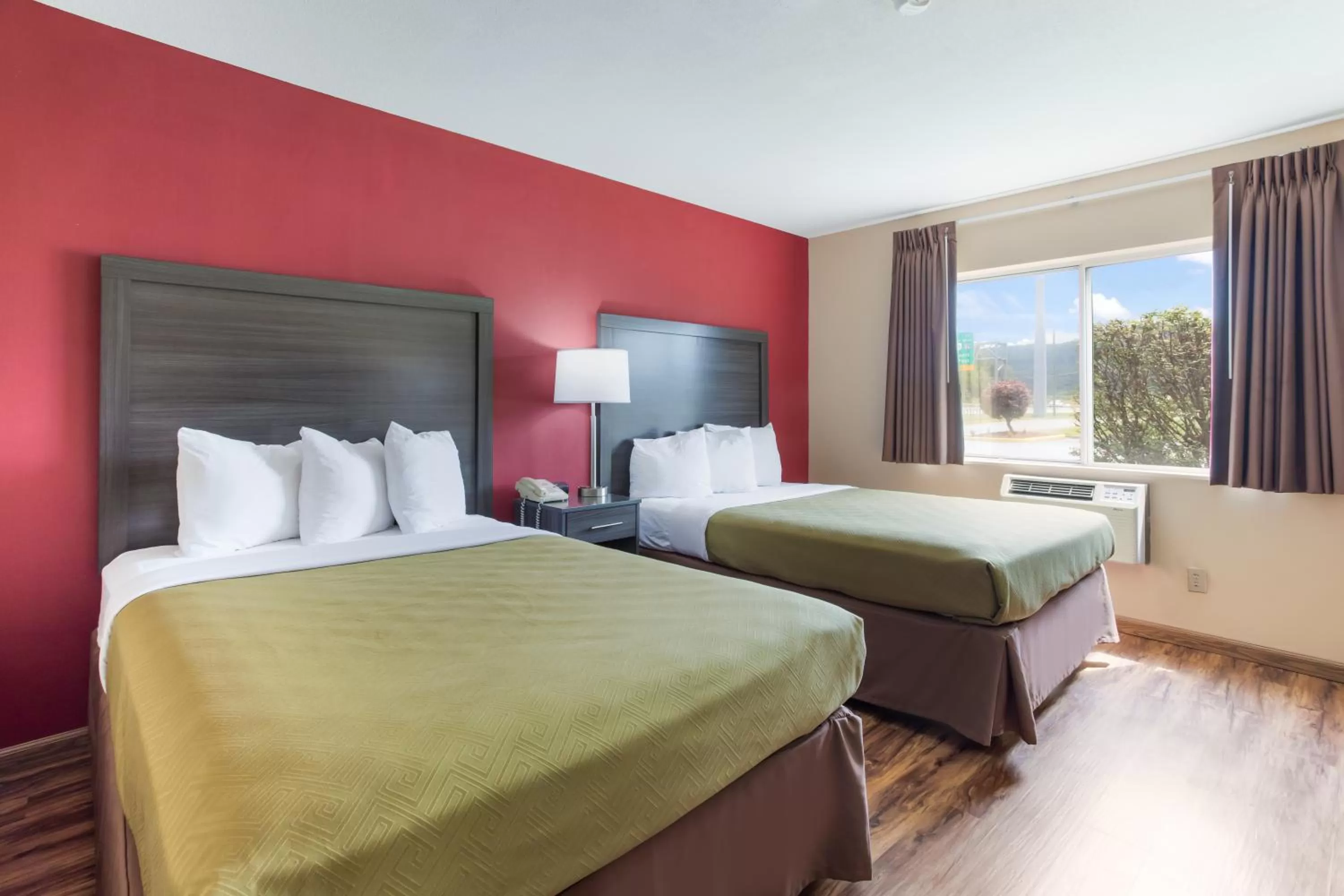 Bed in Econo Lodge Painted Post - Corning