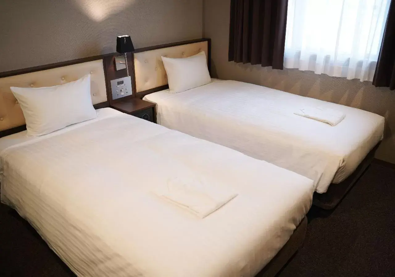 Bed in Welina Hotel Premier Shinsaibashi