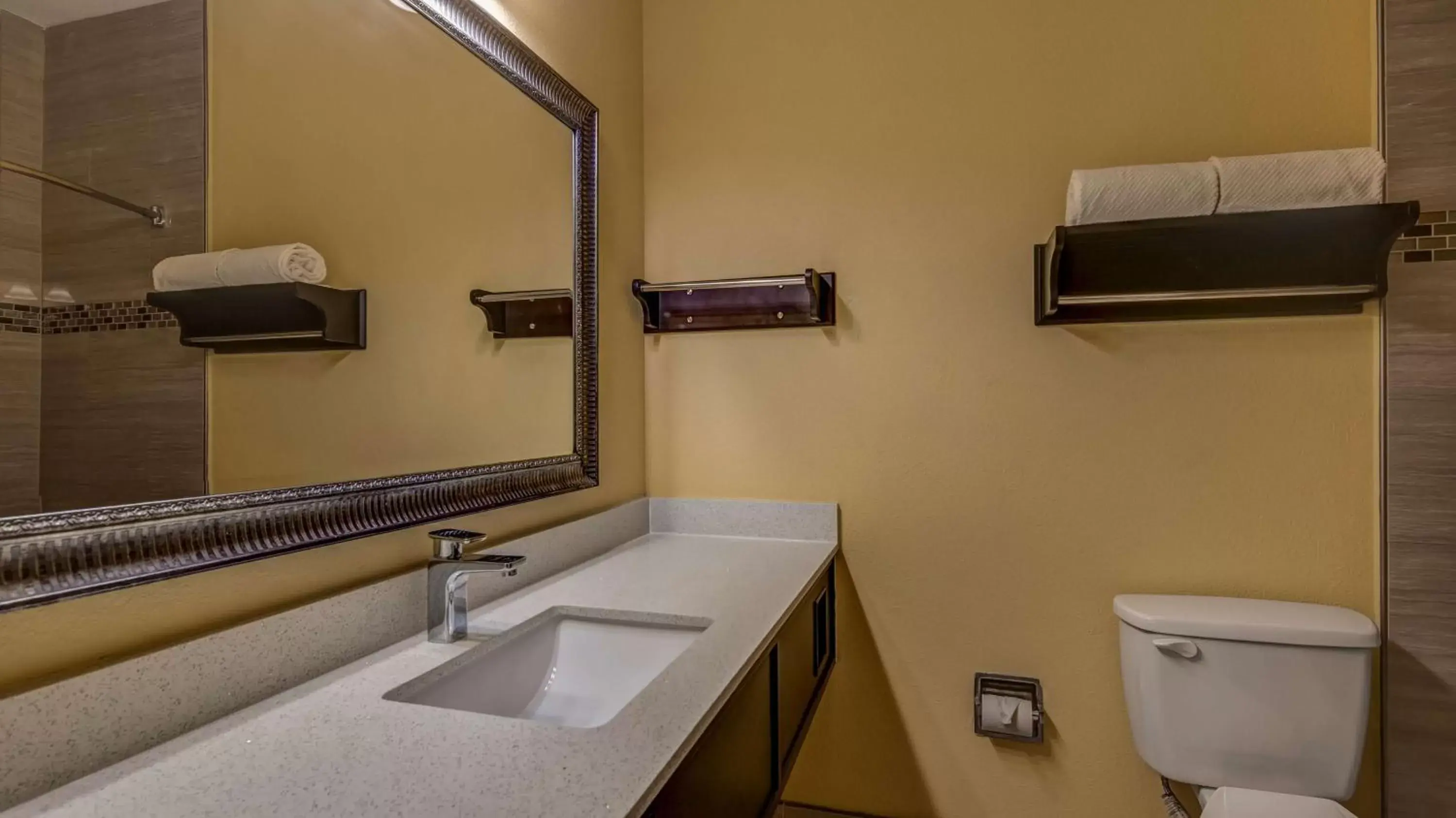 Bathroom in SureStay Plus Hotel by Best Western Alvin