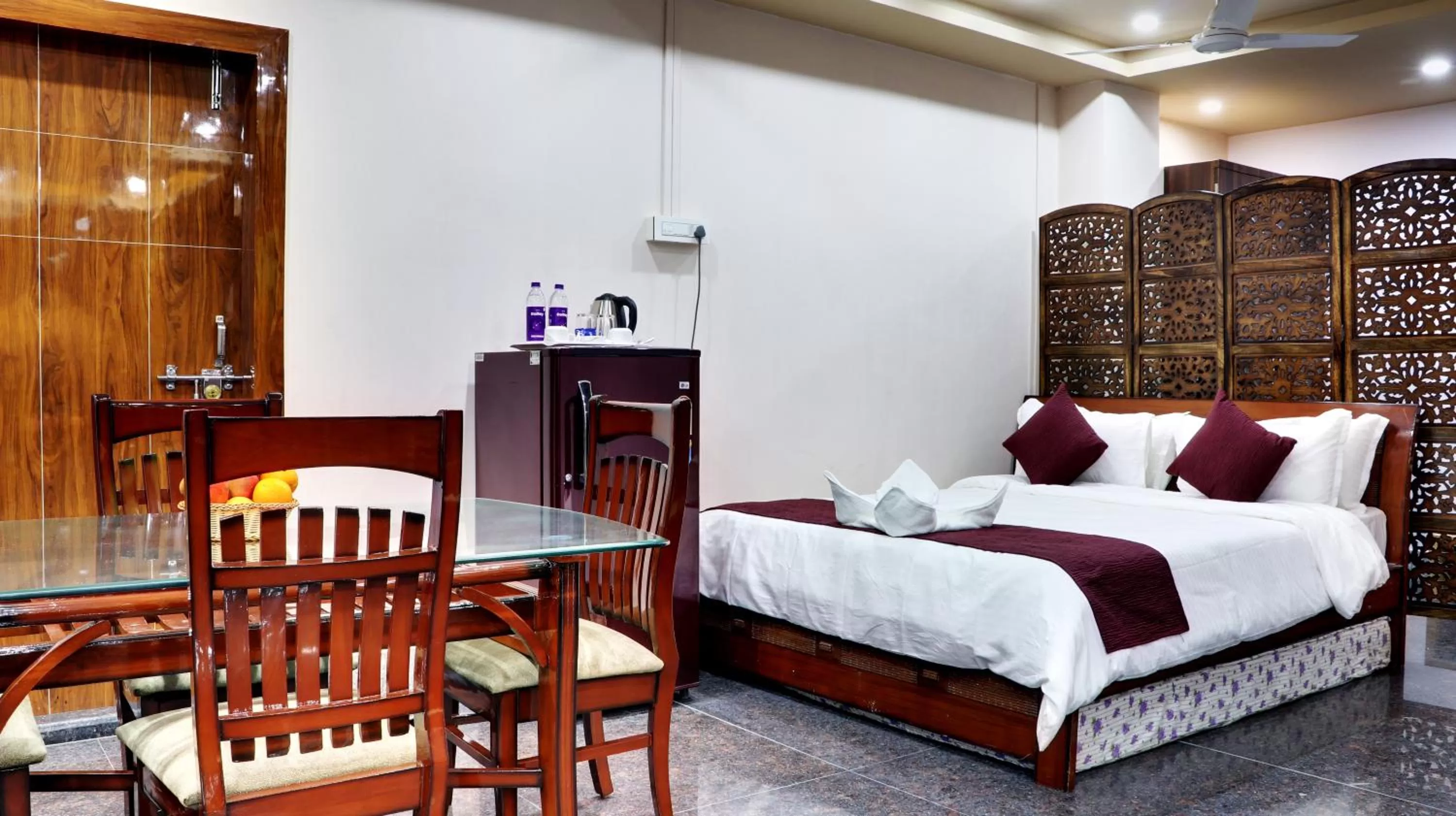 Photo of the whole room, Bed in Bharalu Residency