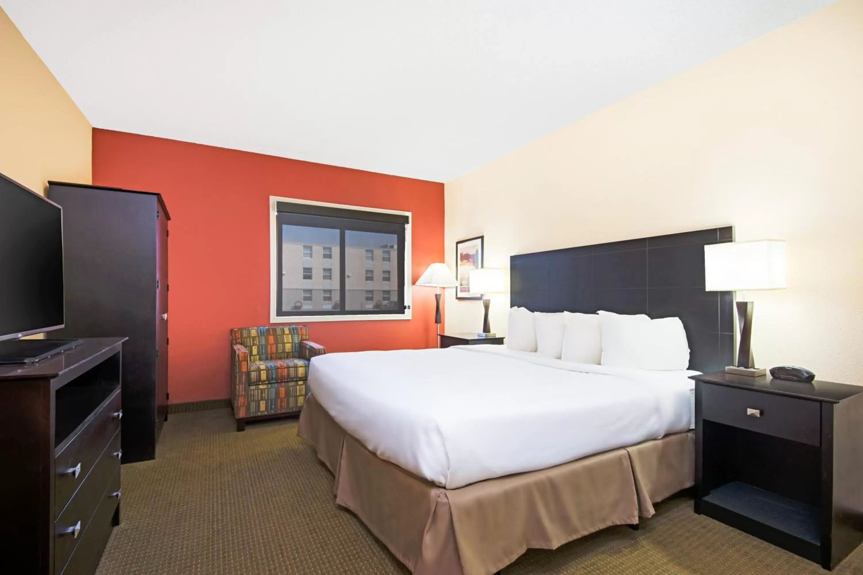 Bed in Ramada Plaza by Wyndham Gillette Conference Center