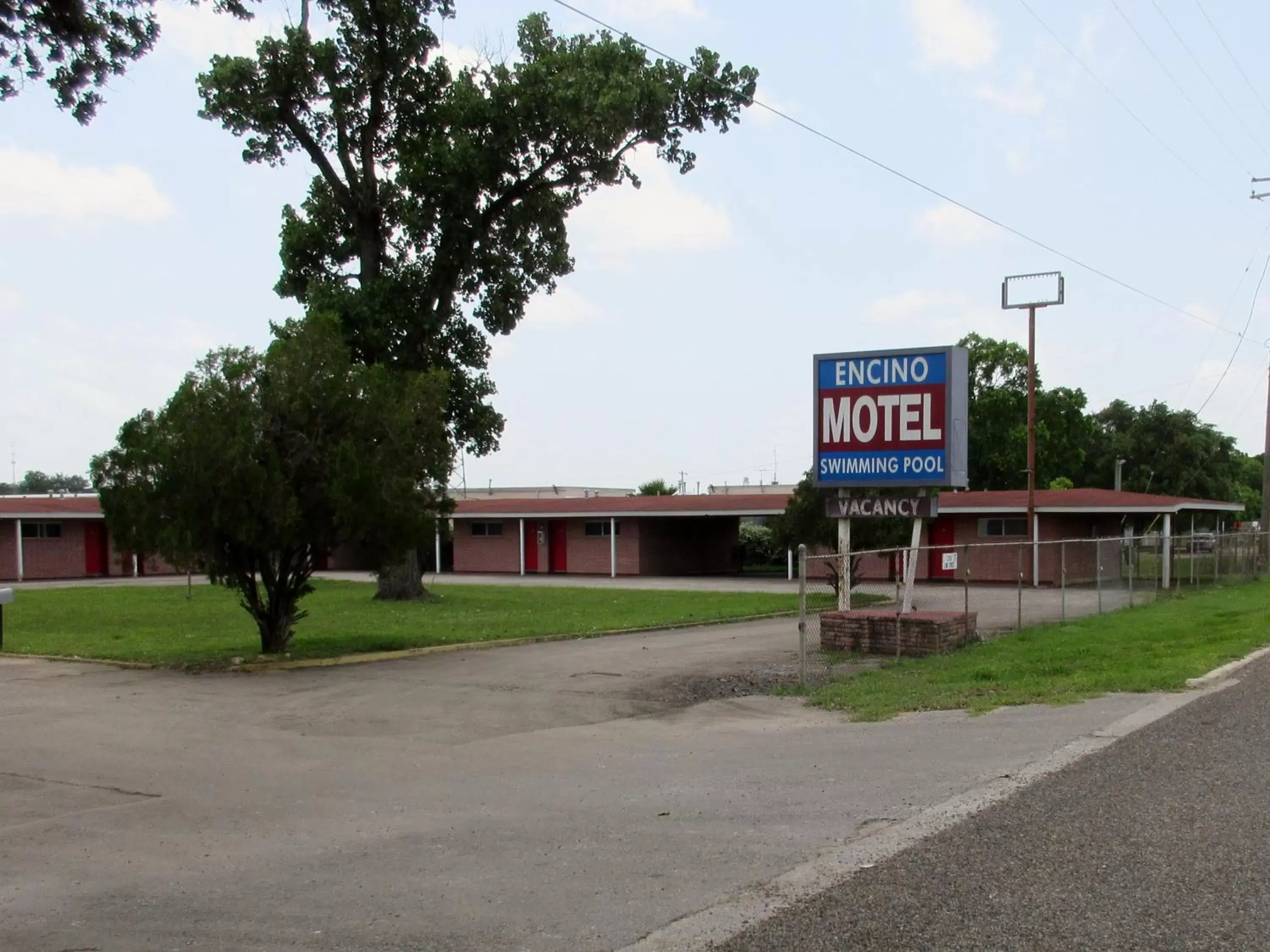 Property logo or sign, Property Building in Encino Motel